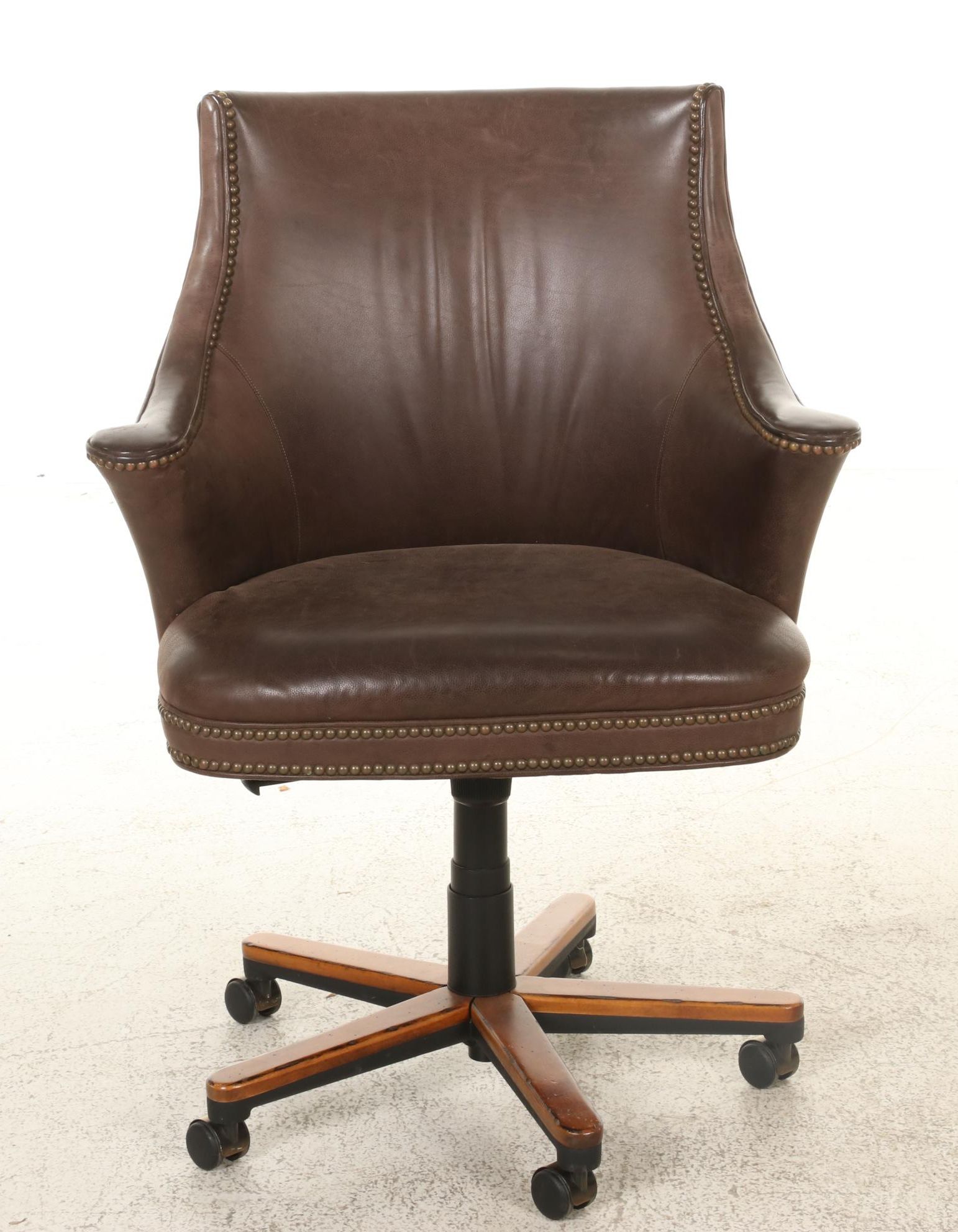 Pair of Brass-Tacked and Aged Leather Upholstered Adjustable Swivel Chairs