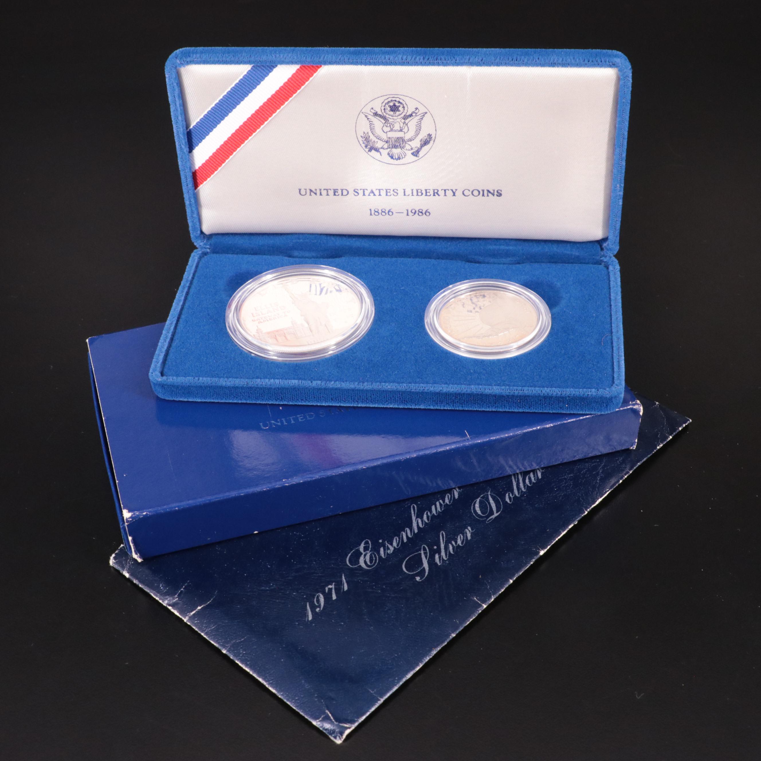 Two Statue of Liberty Commemorative Coin Sets and an Eisenhower Silver Dollar
