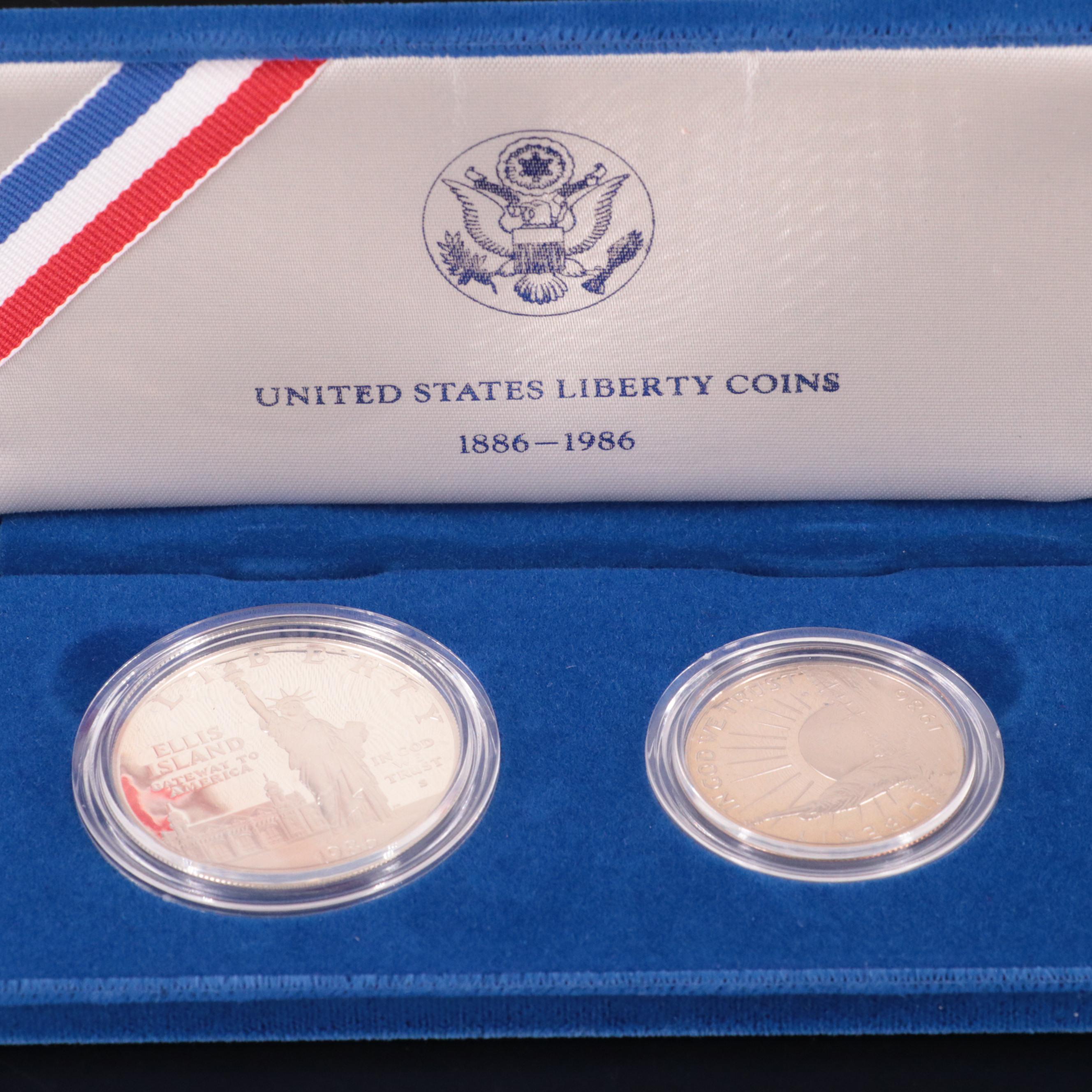 Two Statue of Liberty Commemorative Coin Sets and an Eisenhower Silver Dollar