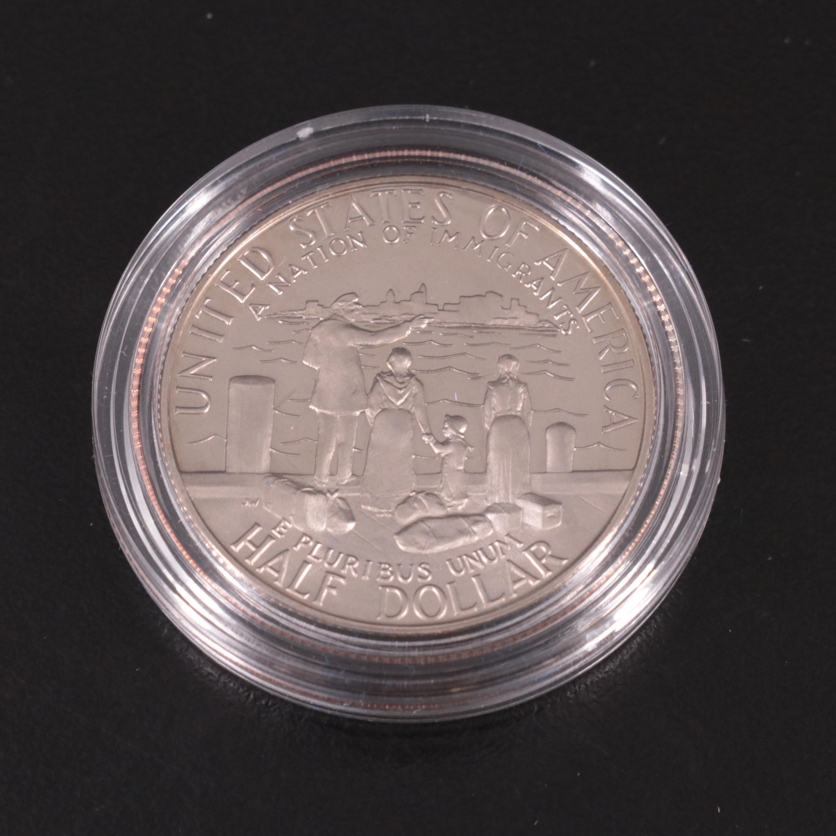 Two Statue of Liberty Commemorative Coin Sets and an Eisenhower Silver Dollar