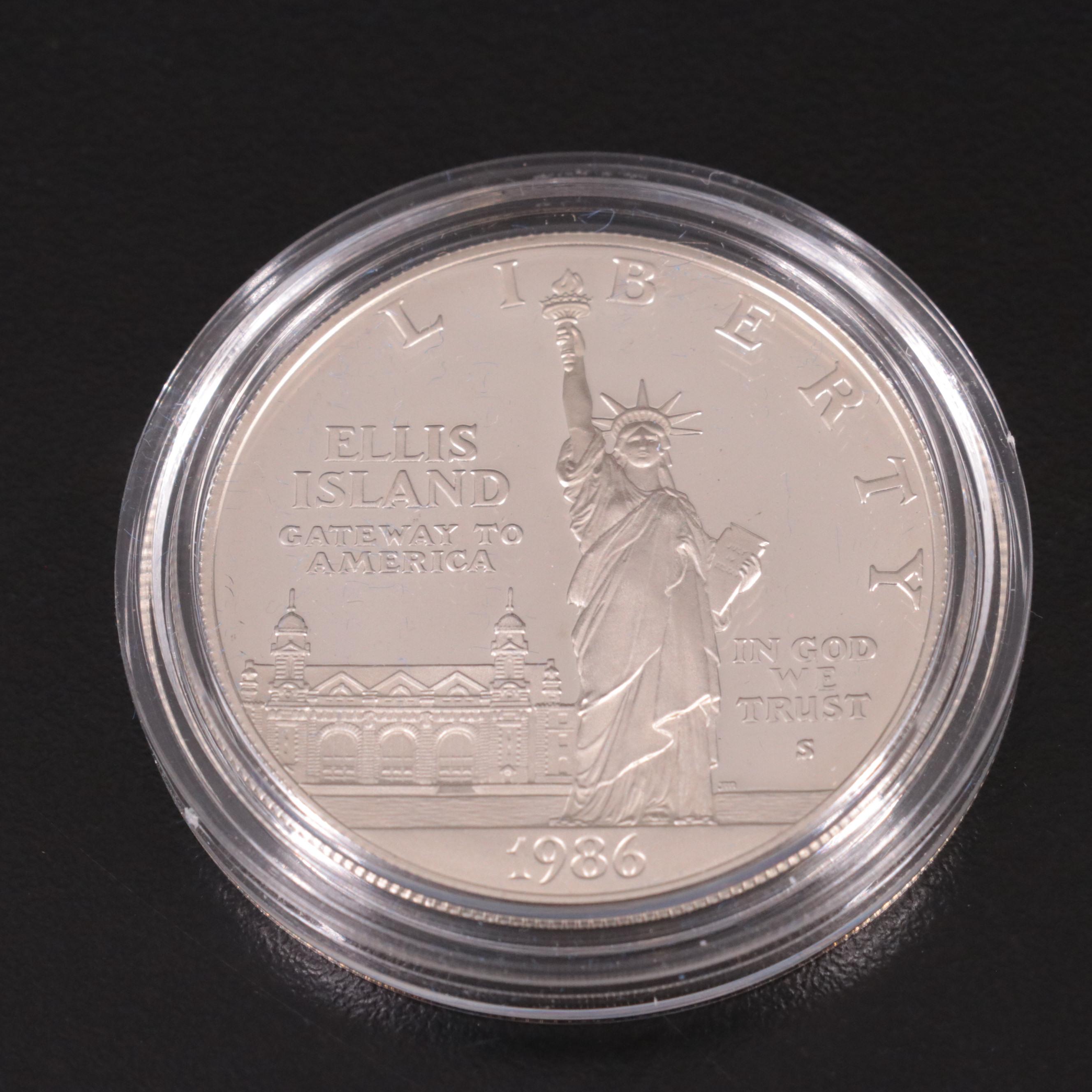 Two Statue of Liberty Commemorative Coin Sets and an Eisenhower Silver Dollar