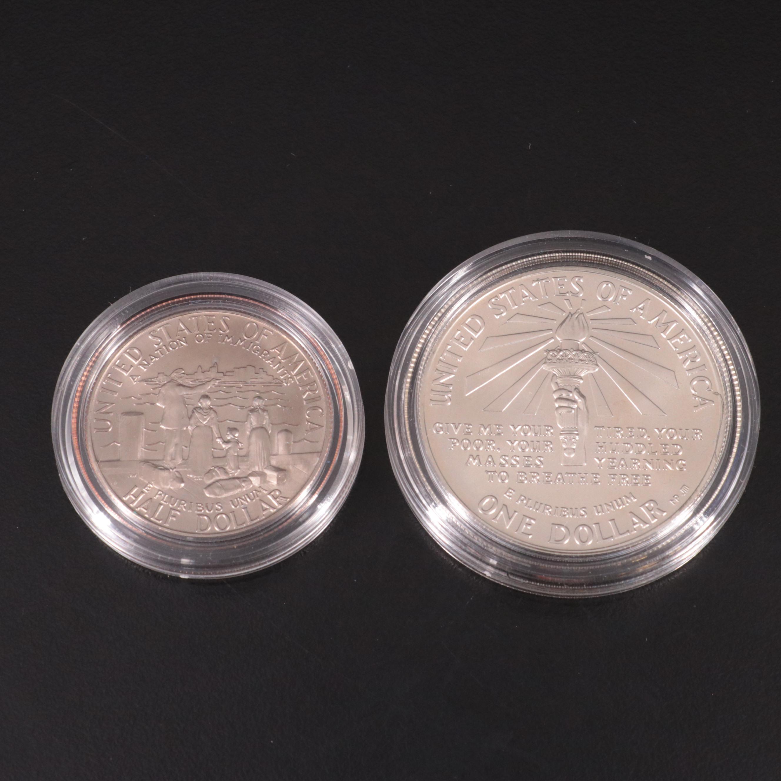Two Statue of Liberty Commemorative Coin Sets and an Eisenhower Silver Dollar
