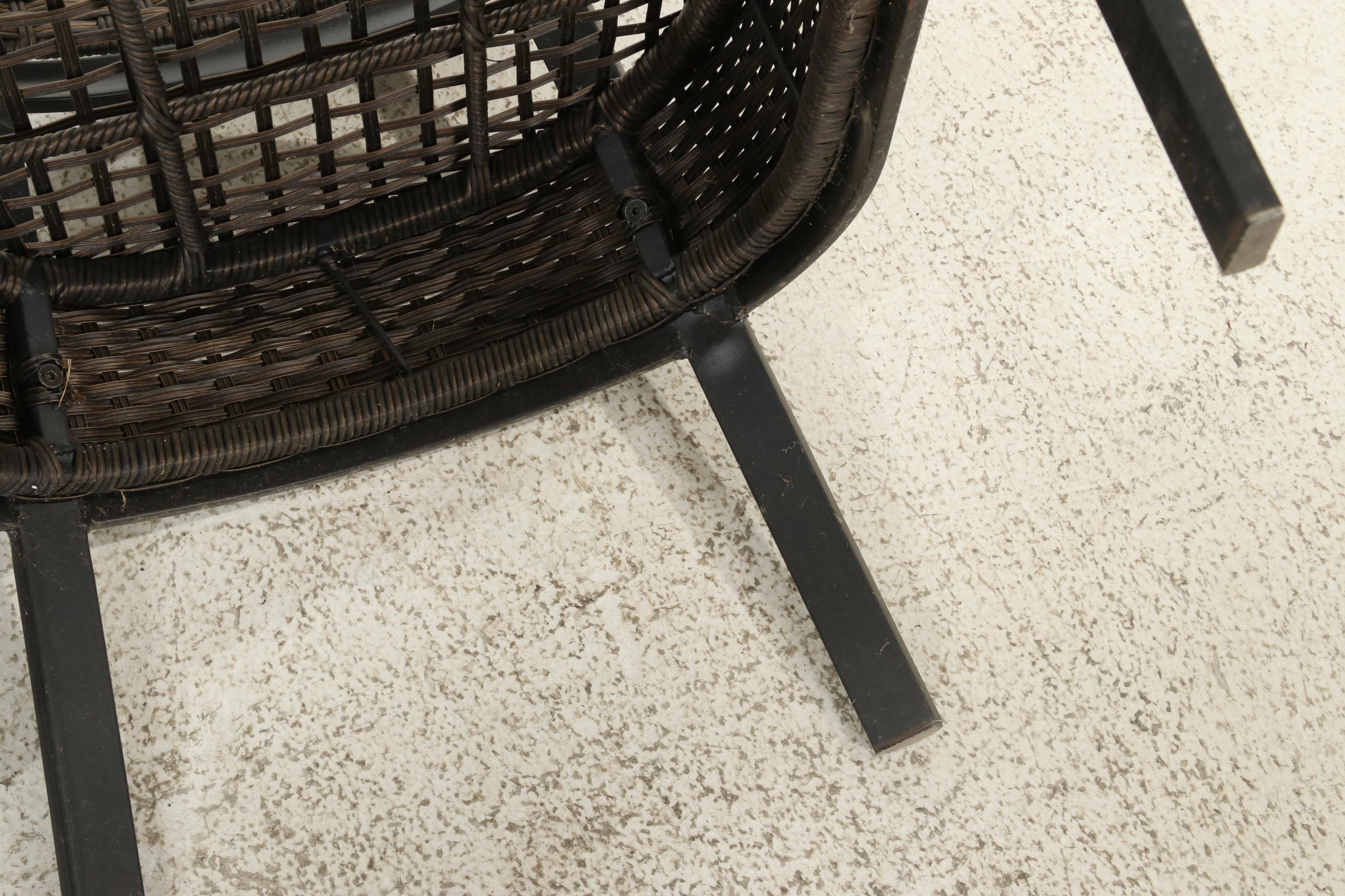 Two Contemporary Resin Wicker Patio Chairs and Ottomans With Accent Table