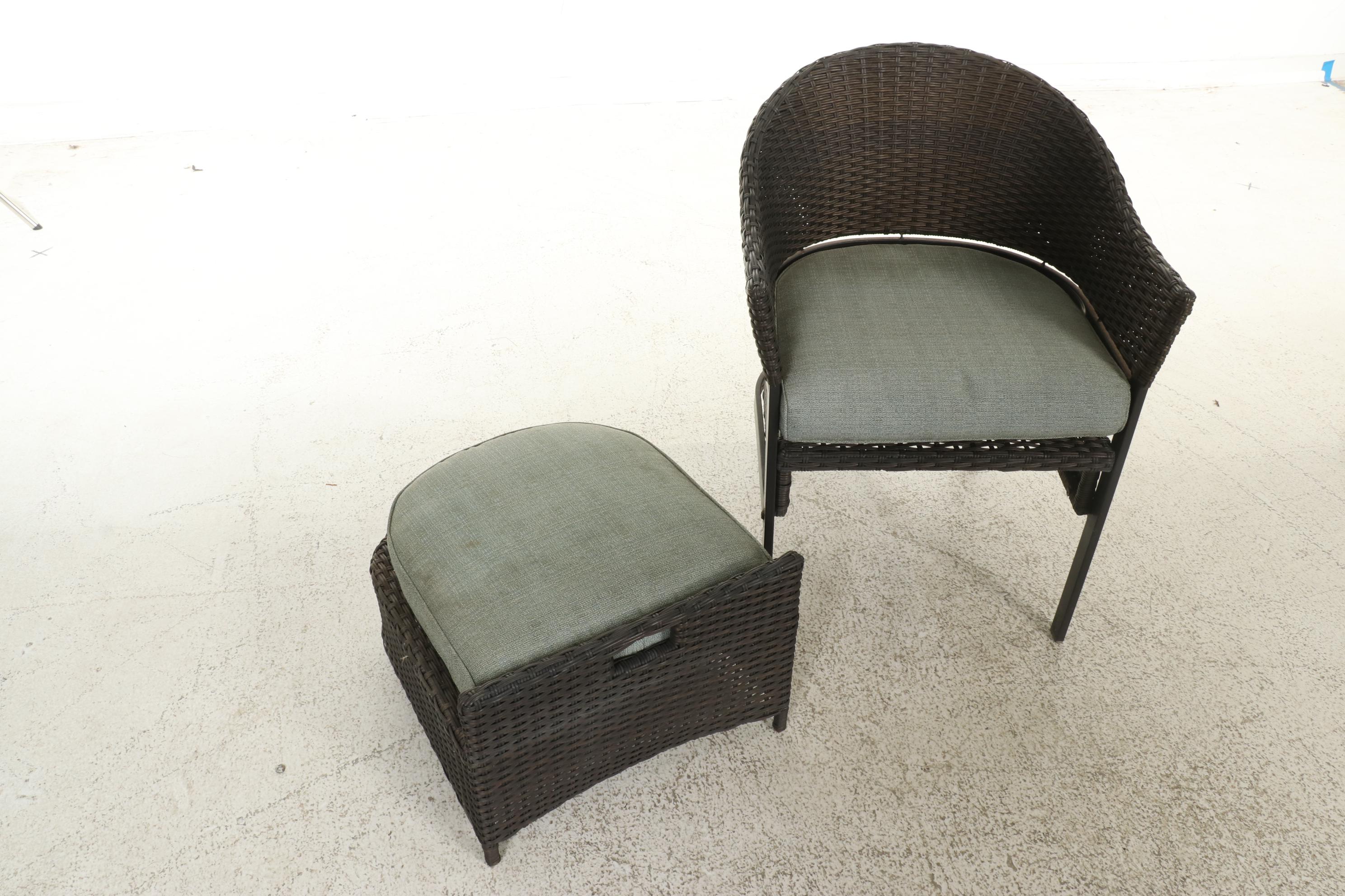 Two Contemporary Resin Wicker Patio Chairs and Ottomans With Accent Table