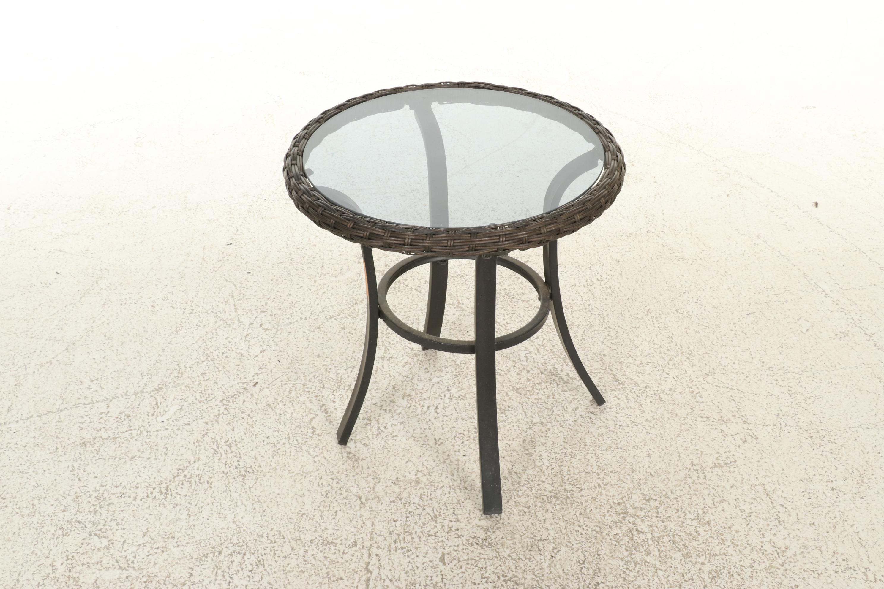 Two Contemporary Resin Wicker Patio Chairs and Ottomans With Accent Table