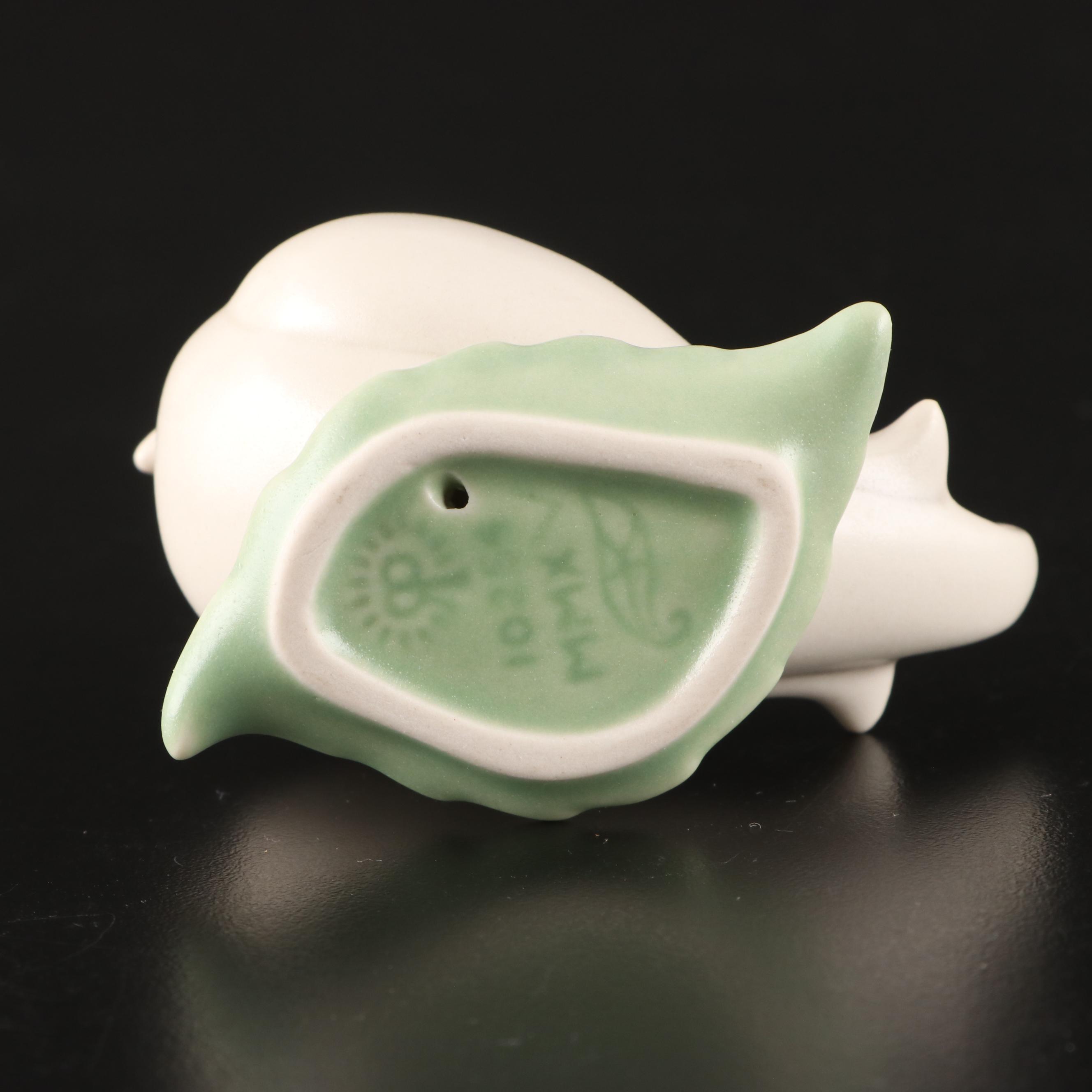 Rookwood Pottery Ivory Glaze Elephant Bookends with Bird on Leaf Figurine