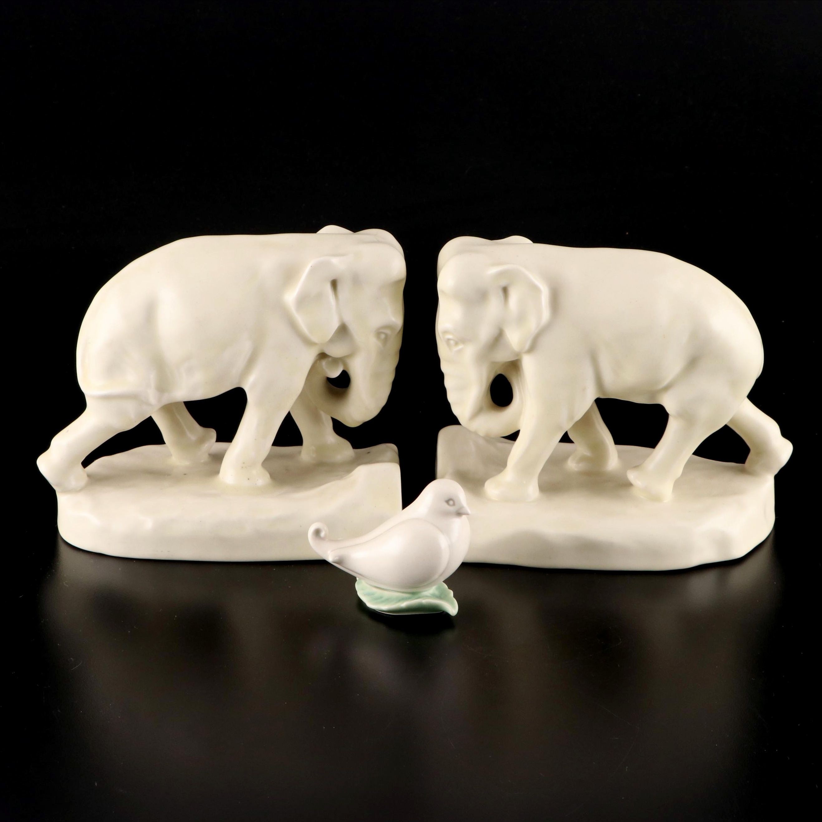 Rookwood Pottery Ivory Glaze Elephant Bookends with Bird on Leaf Figurine