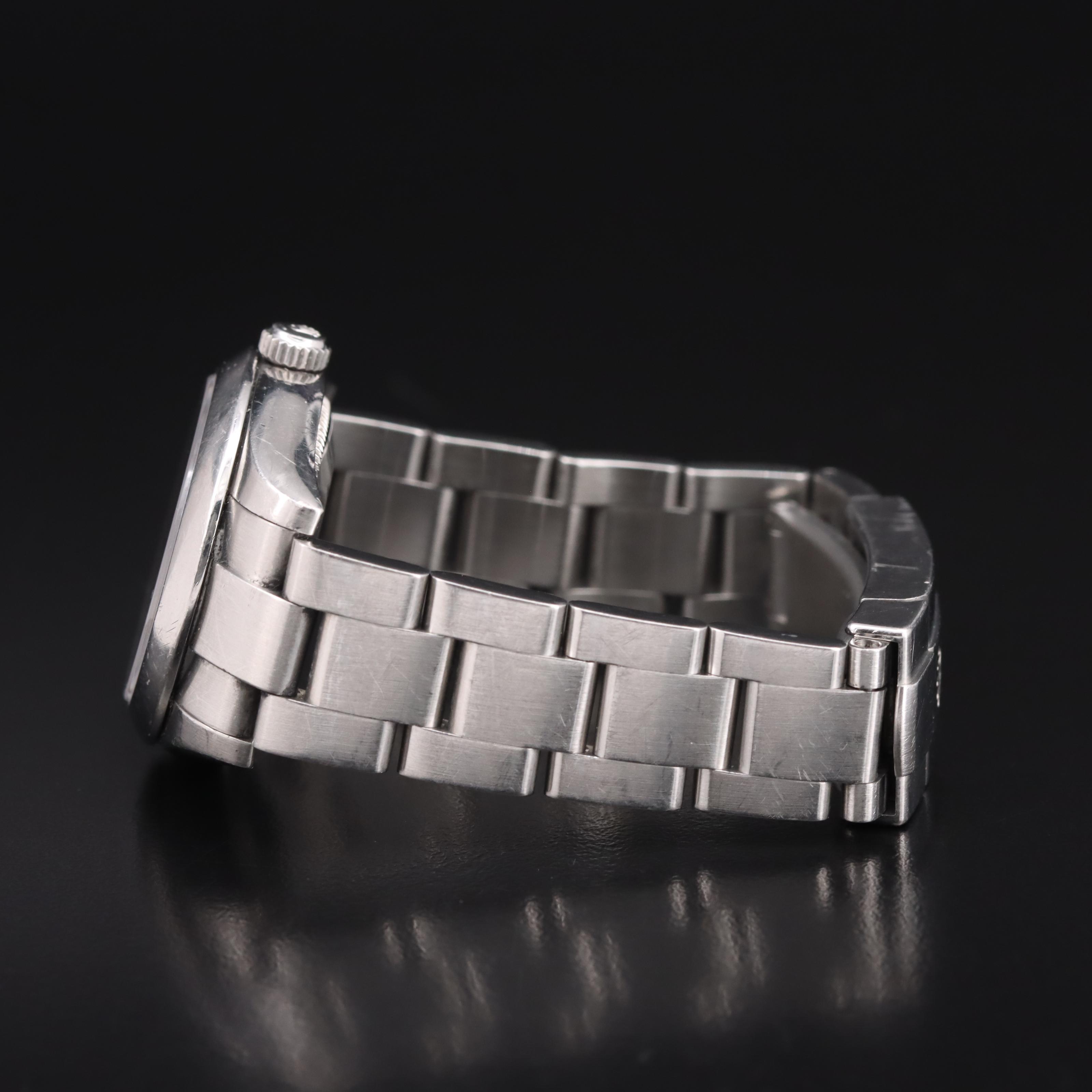 Rolex Oyster Perpetual Black Arabic and Blue Markers Dial Watch