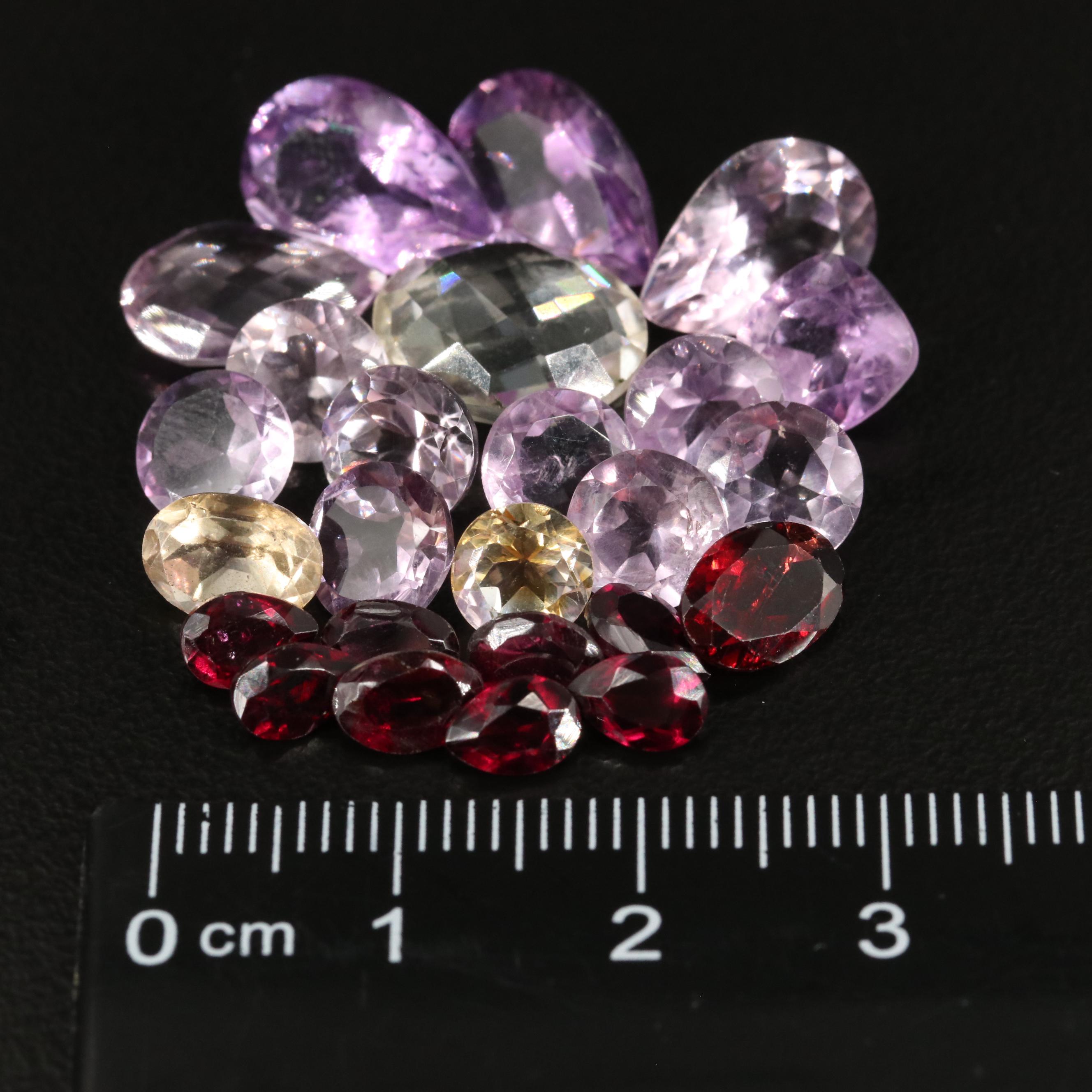 Loose 33.75 CTW Amethyst, Citrine, and Garnet Lot