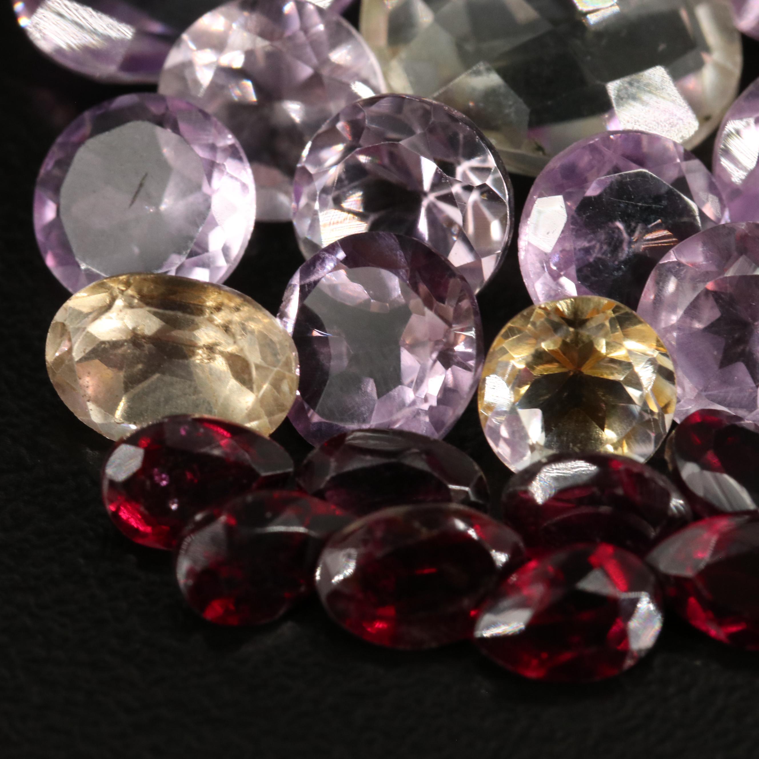 Loose 33.75 CTW Amethyst, Citrine, and Garnet Lot