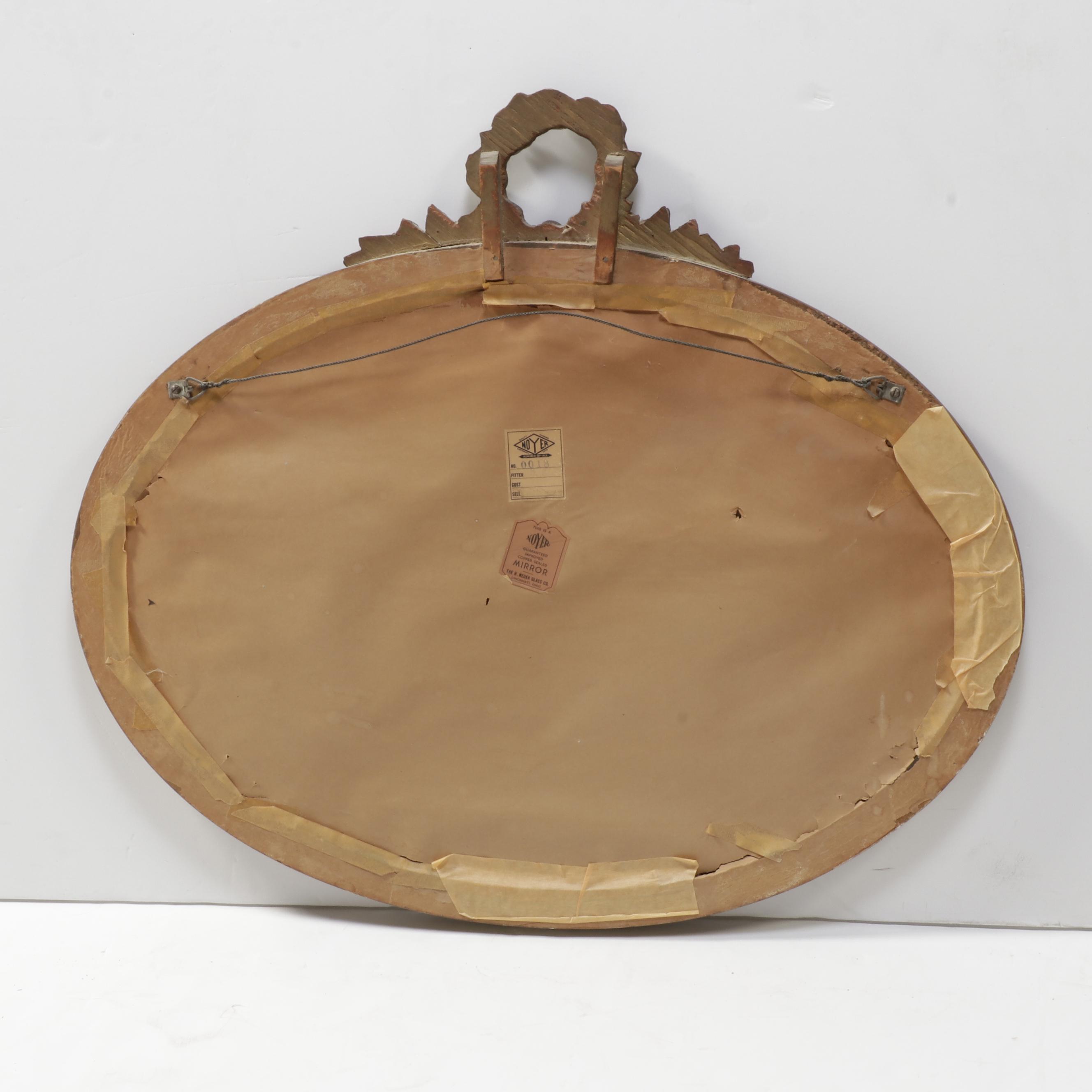 H. Neuer Glass Co. Floral Carved Wood Framed Oval Wall Mirror, Mid-20th Century