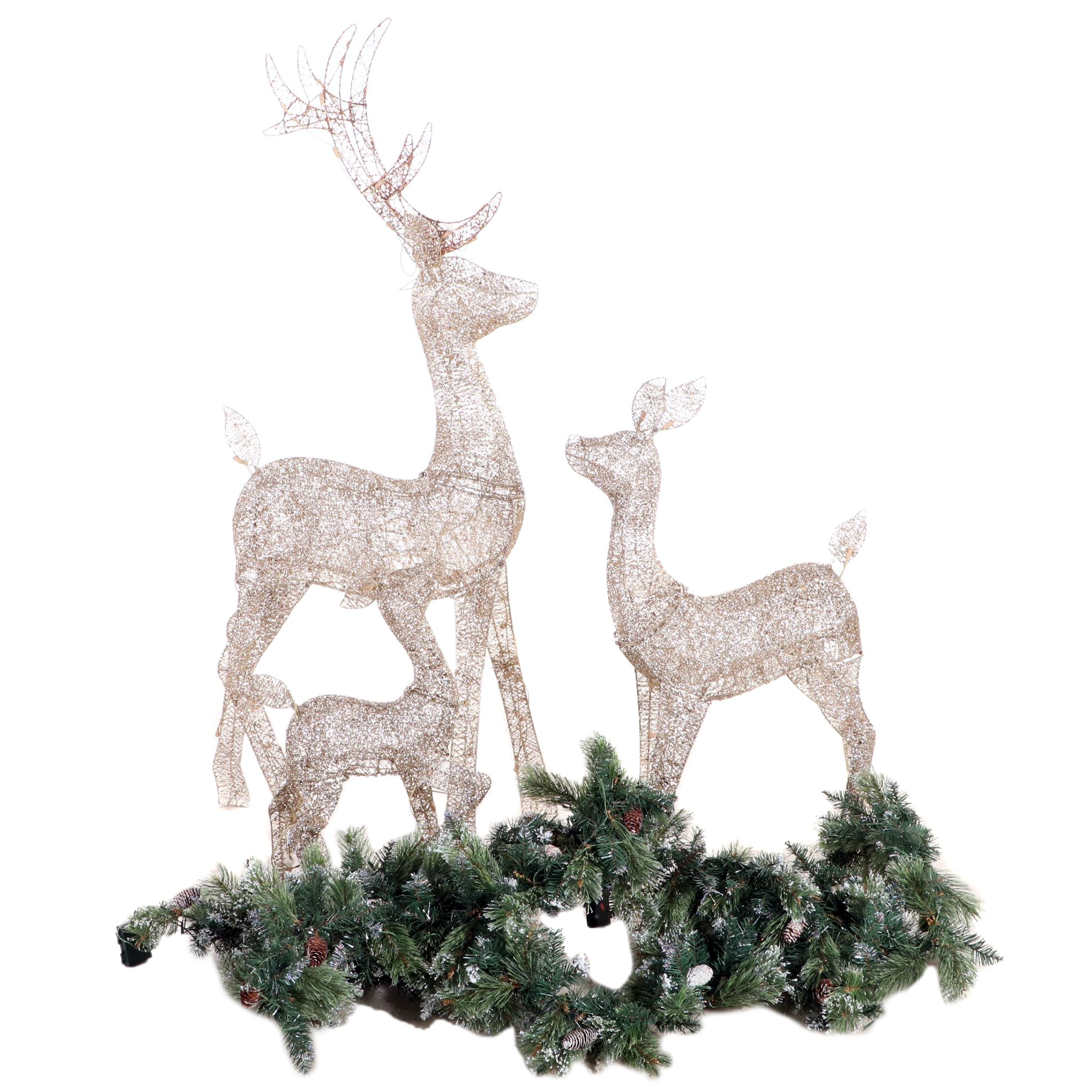 Glittering Illuminated Grapevine Reindeer Figures With Faux Evergreen Garland