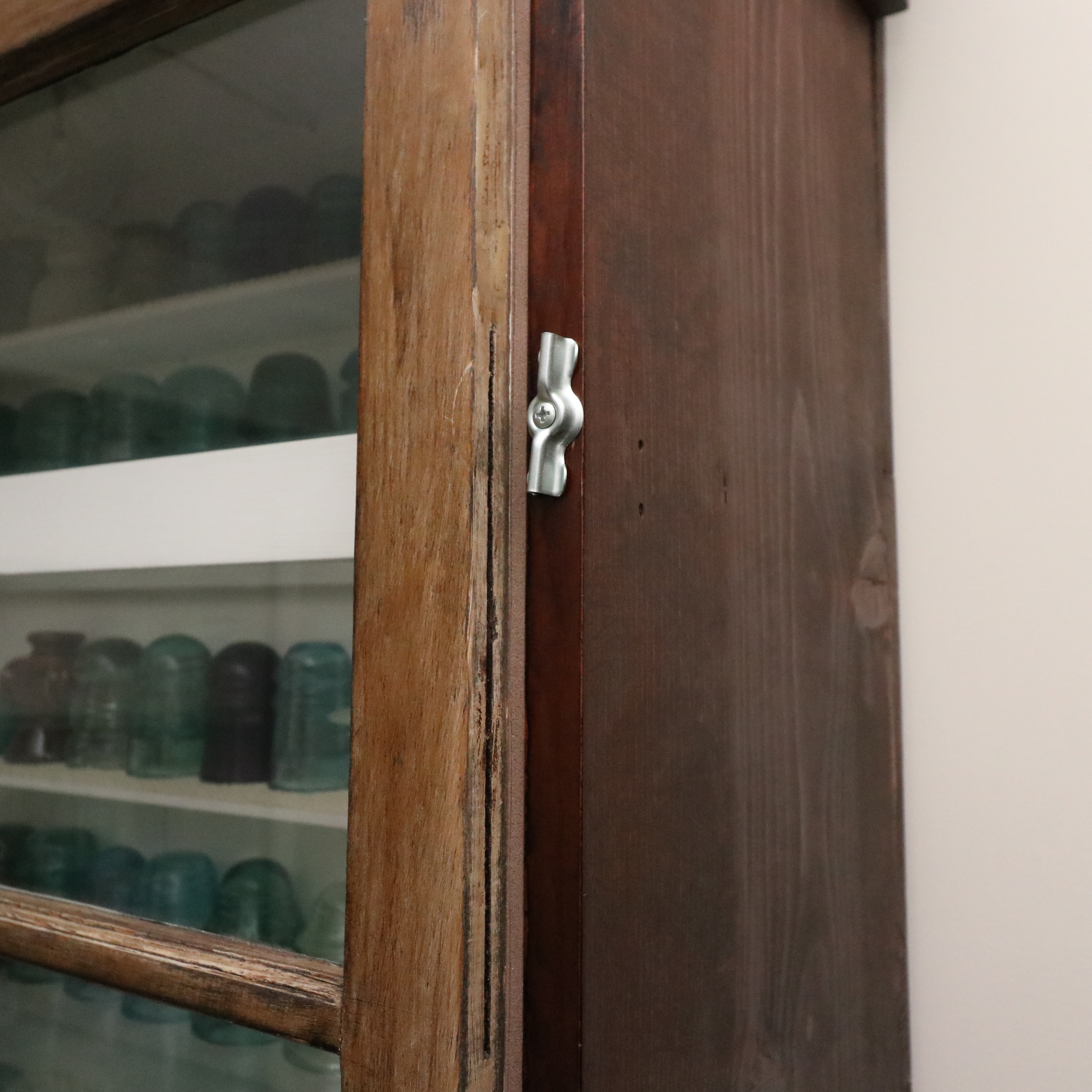 Handcrafted Curio Cabinet Featuring an Insulator Collection