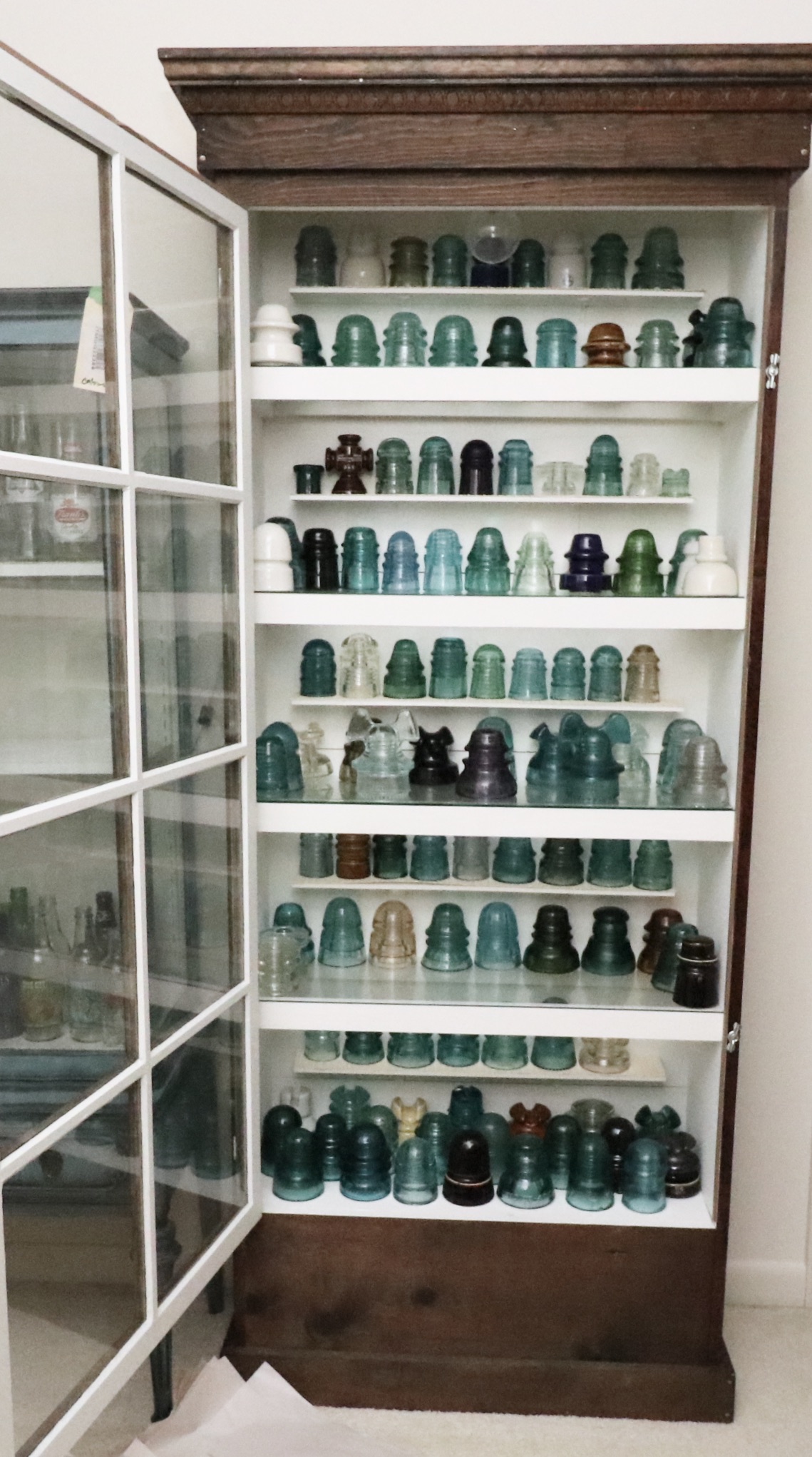 Handcrafted Curio Cabinet Featuring an Insulator Collection
