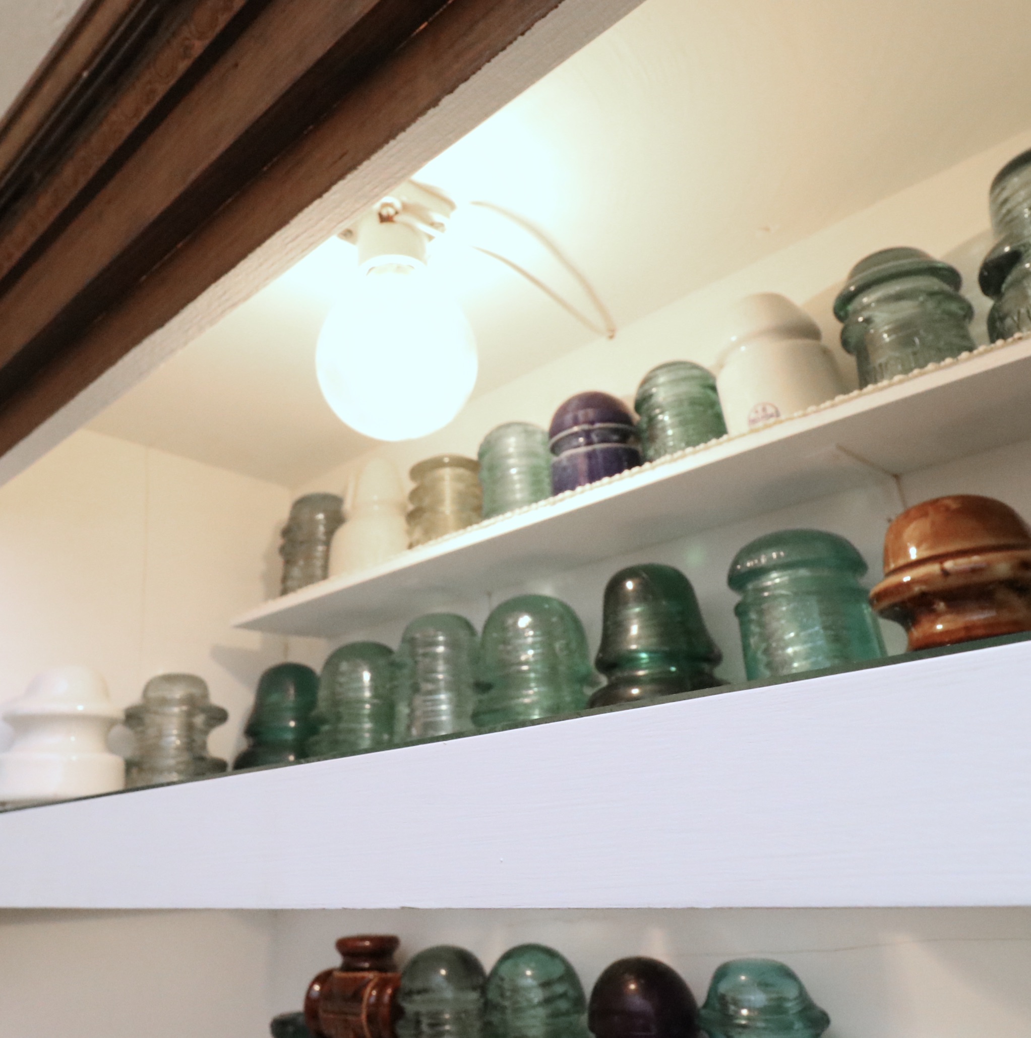 Handcrafted Curio Cabinet Featuring an Insulator Collection