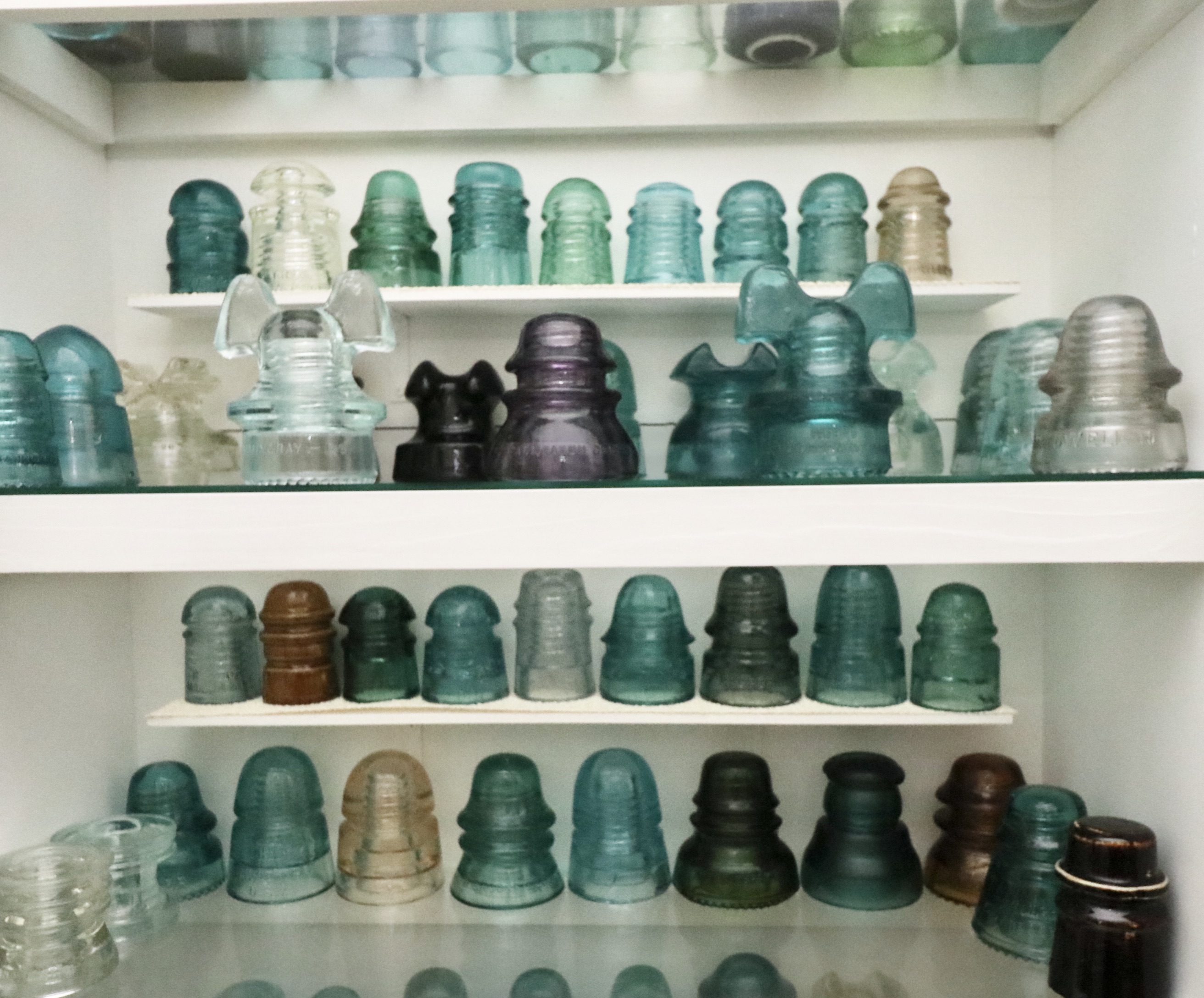 Handcrafted Curio Cabinet Featuring an Insulator Collection