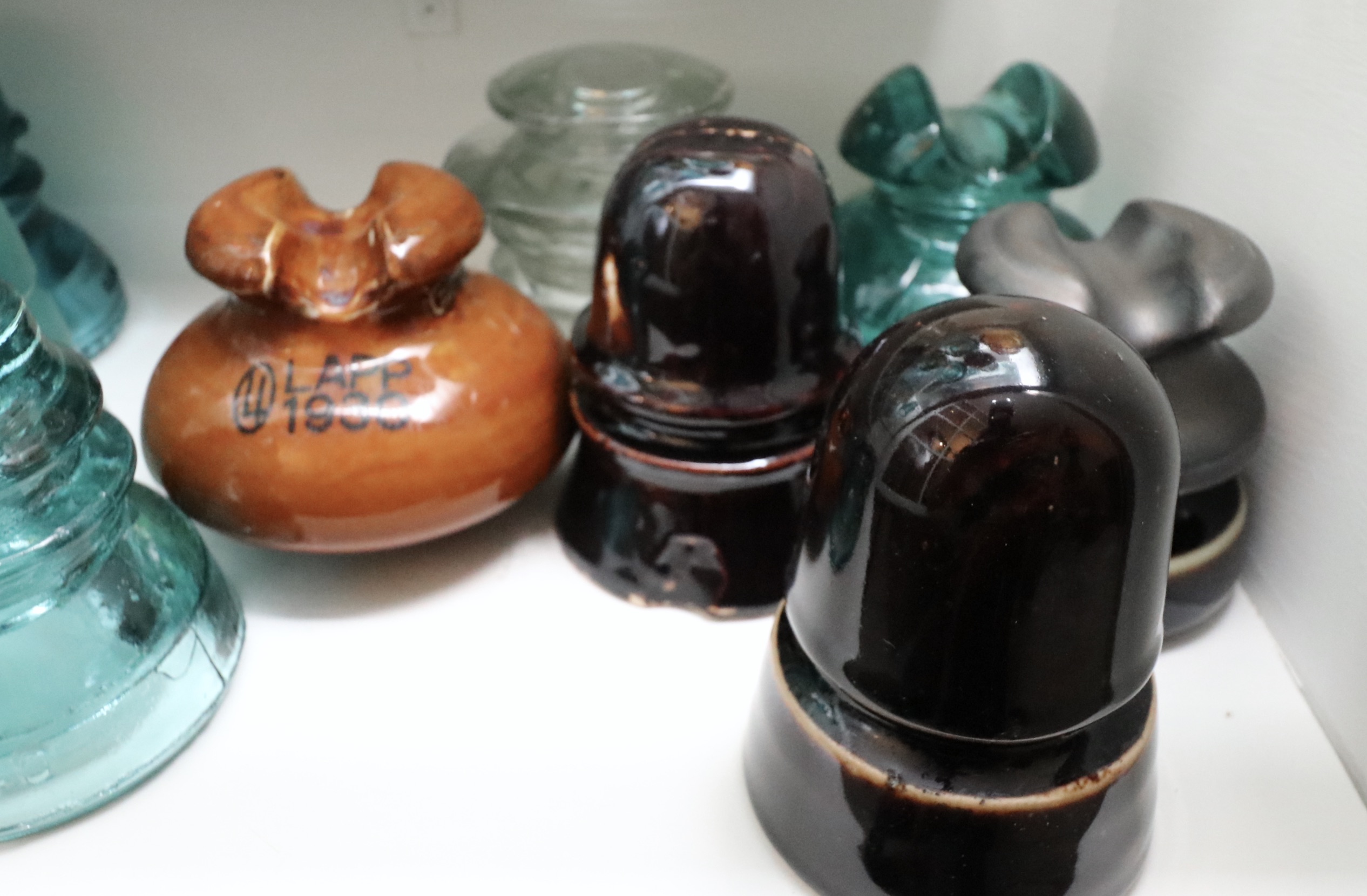 Handcrafted Curio Cabinet Featuring an Insulator Collection