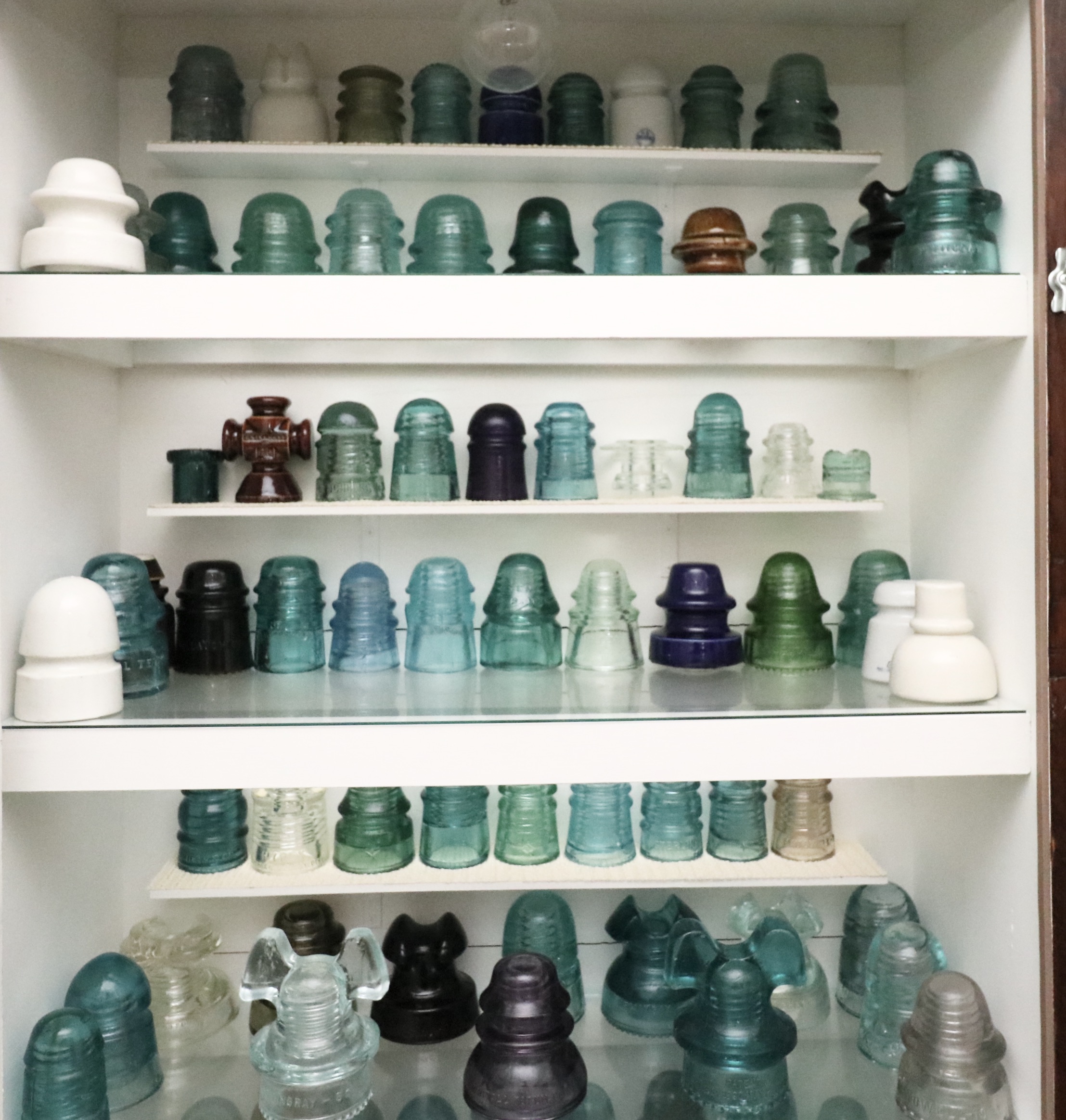 Handcrafted Curio Cabinet Featuring an Insulator Collection