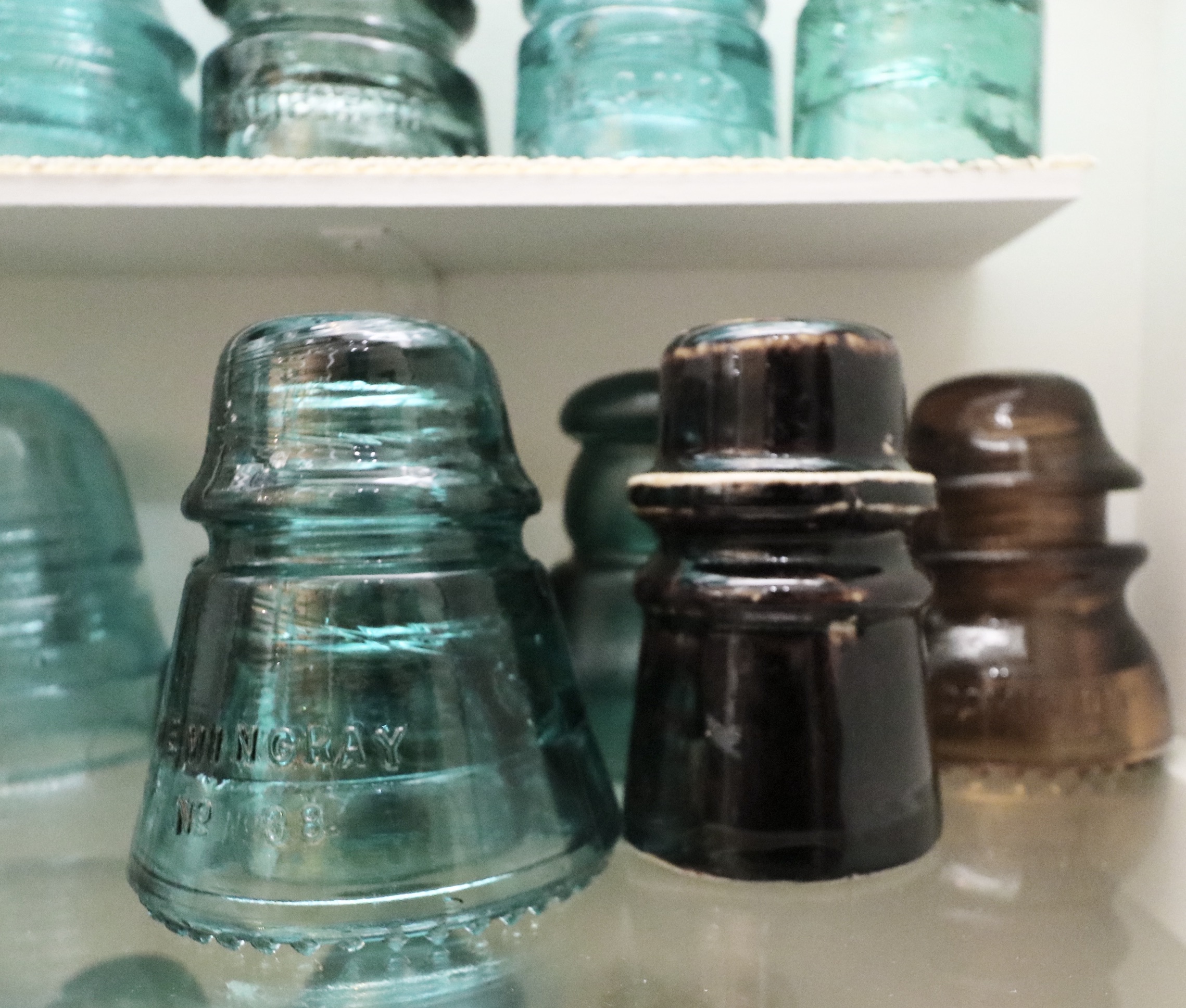 Handcrafted Curio Cabinet Featuring an Insulator Collection