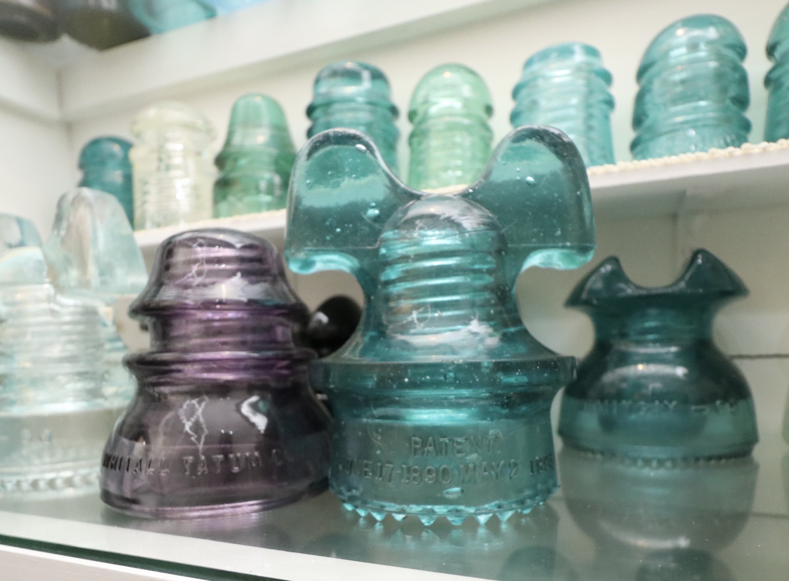 Handcrafted Curio Cabinet Featuring an Insulator Collection