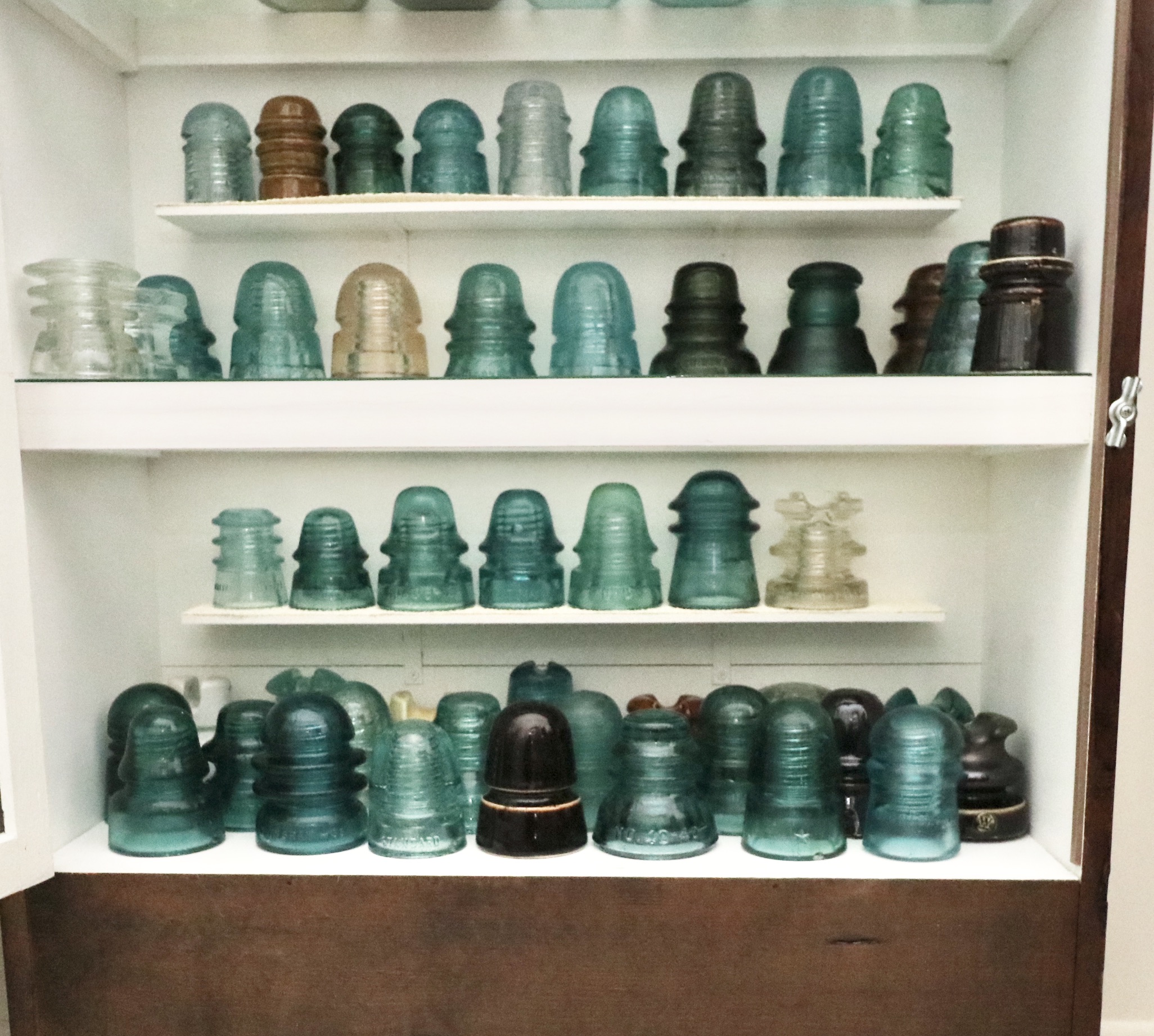 Handcrafted Curio Cabinet Featuring an Insulator Collection