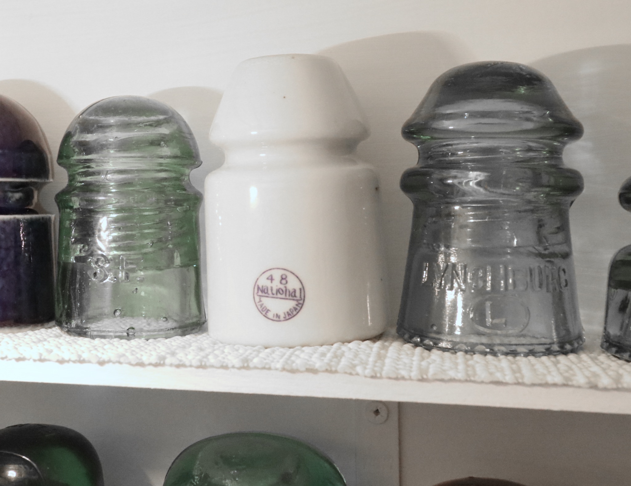 Handcrafted Curio Cabinet Featuring an Insulator Collection