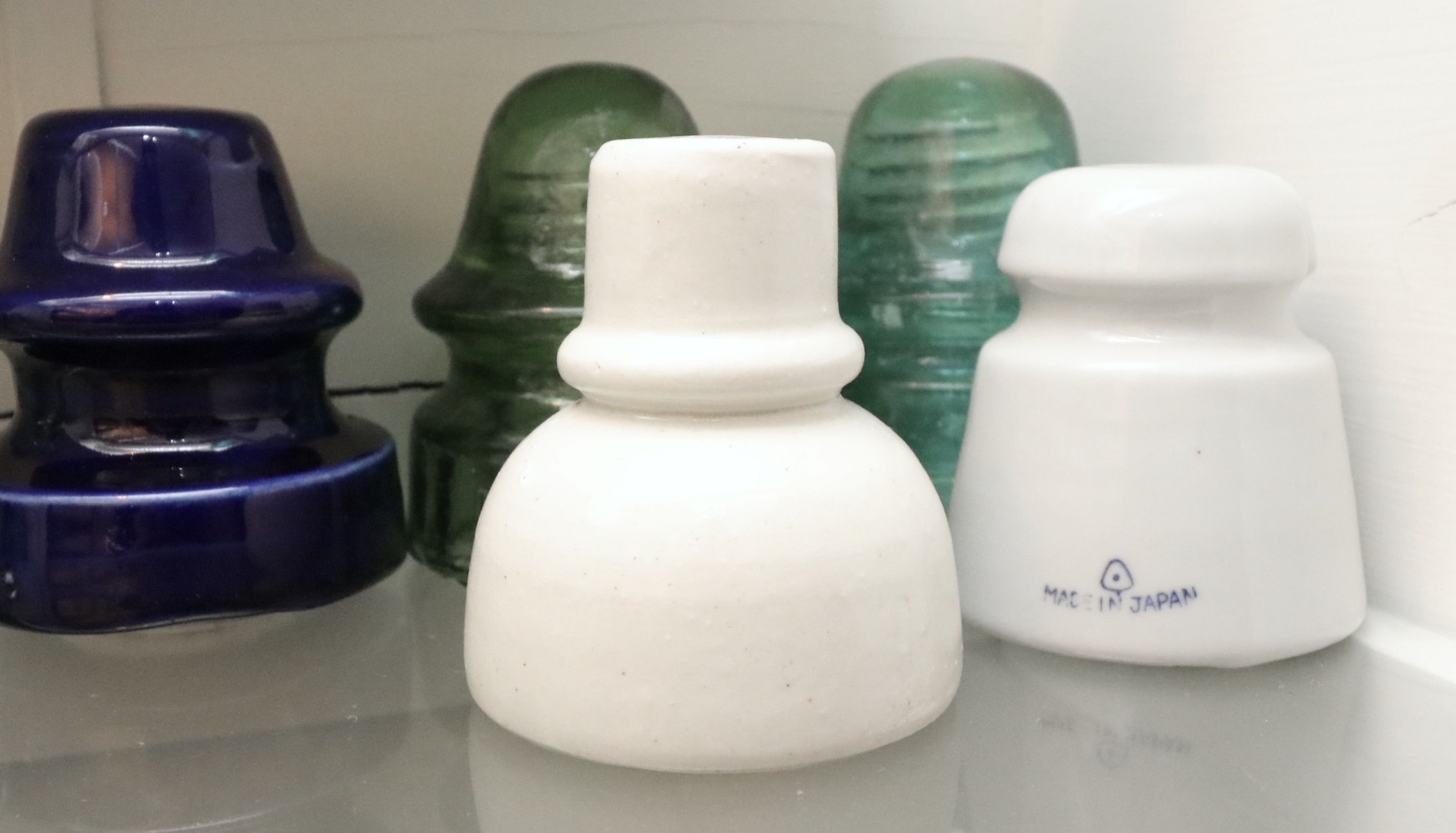 Handcrafted Curio Cabinet Featuring an Insulator Collection