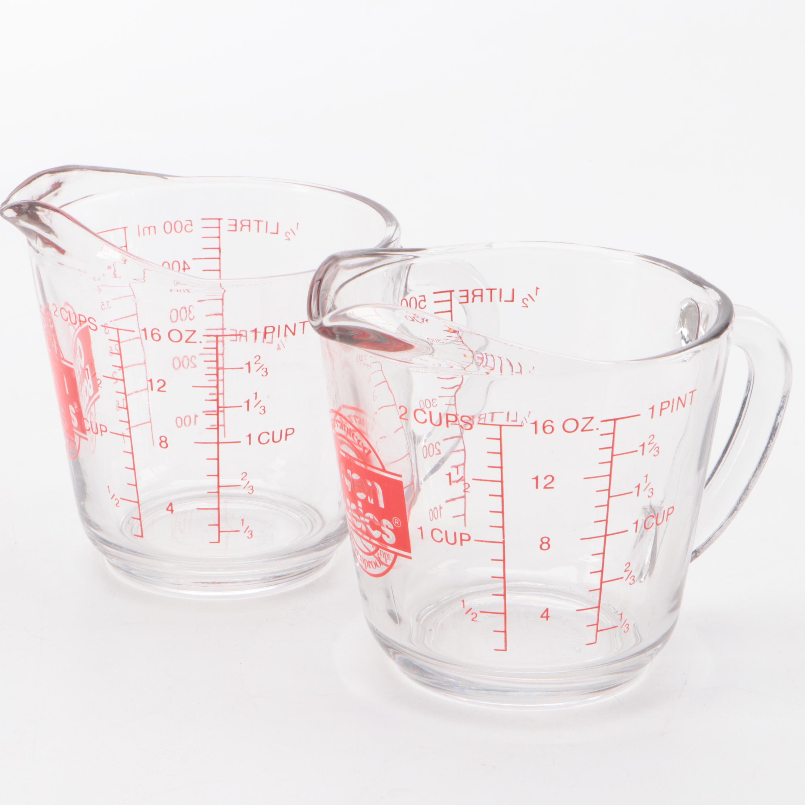 Chantal Enamel Pots with Chased Brass Pepper Mills and Other Cookware