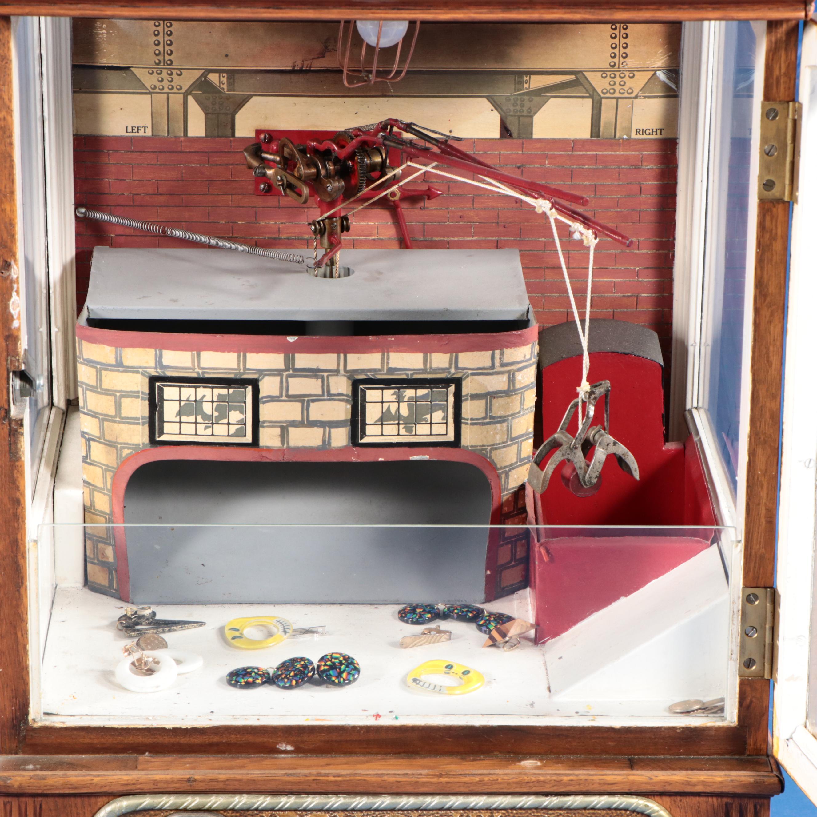 Exhibit Supply Co. Iron Claw Oak Cased Arcade Claw Machine, Early 20th Century