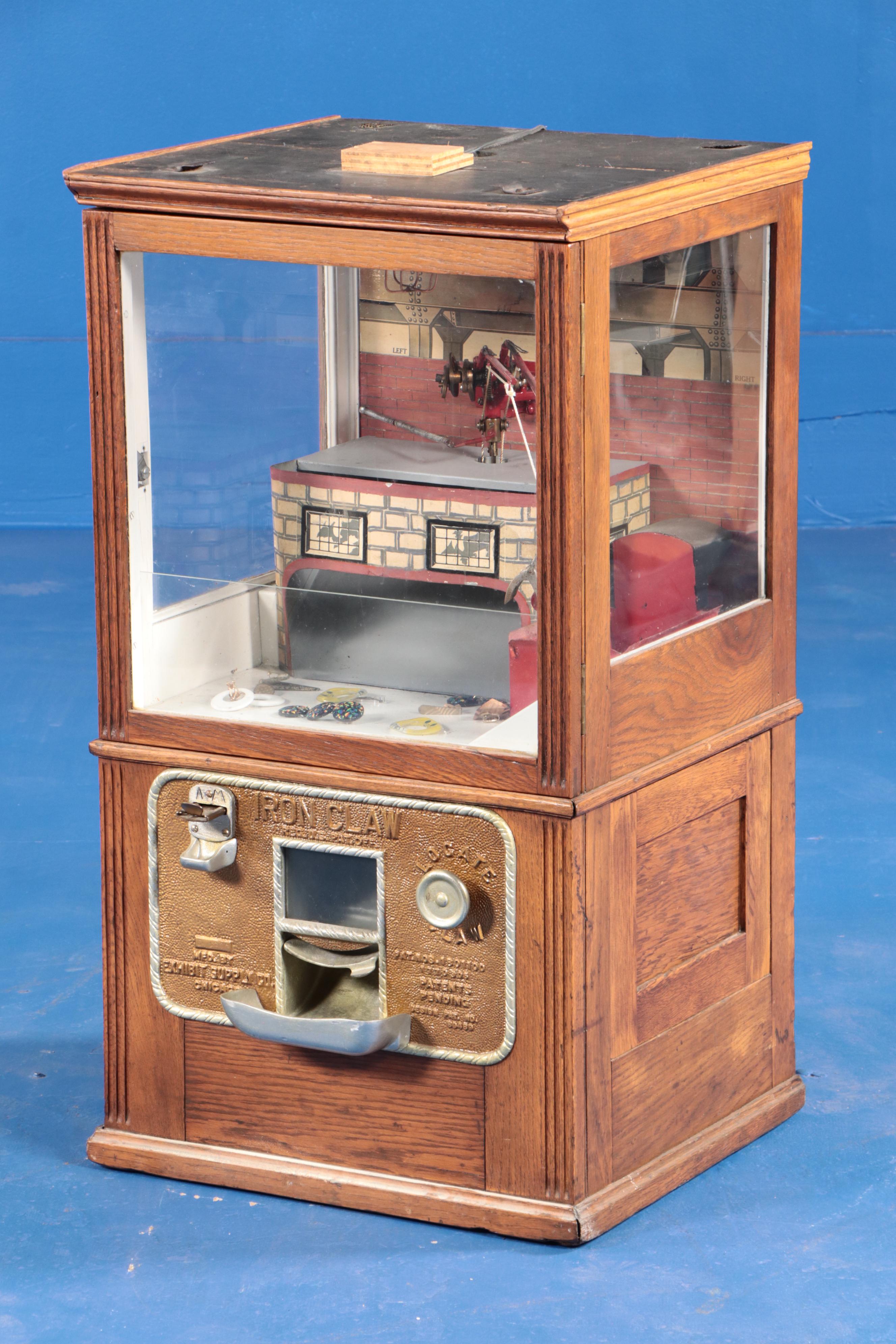 Exhibit Supply Co. Iron Claw Oak Cased Arcade Claw Machine, Early 20th Century
