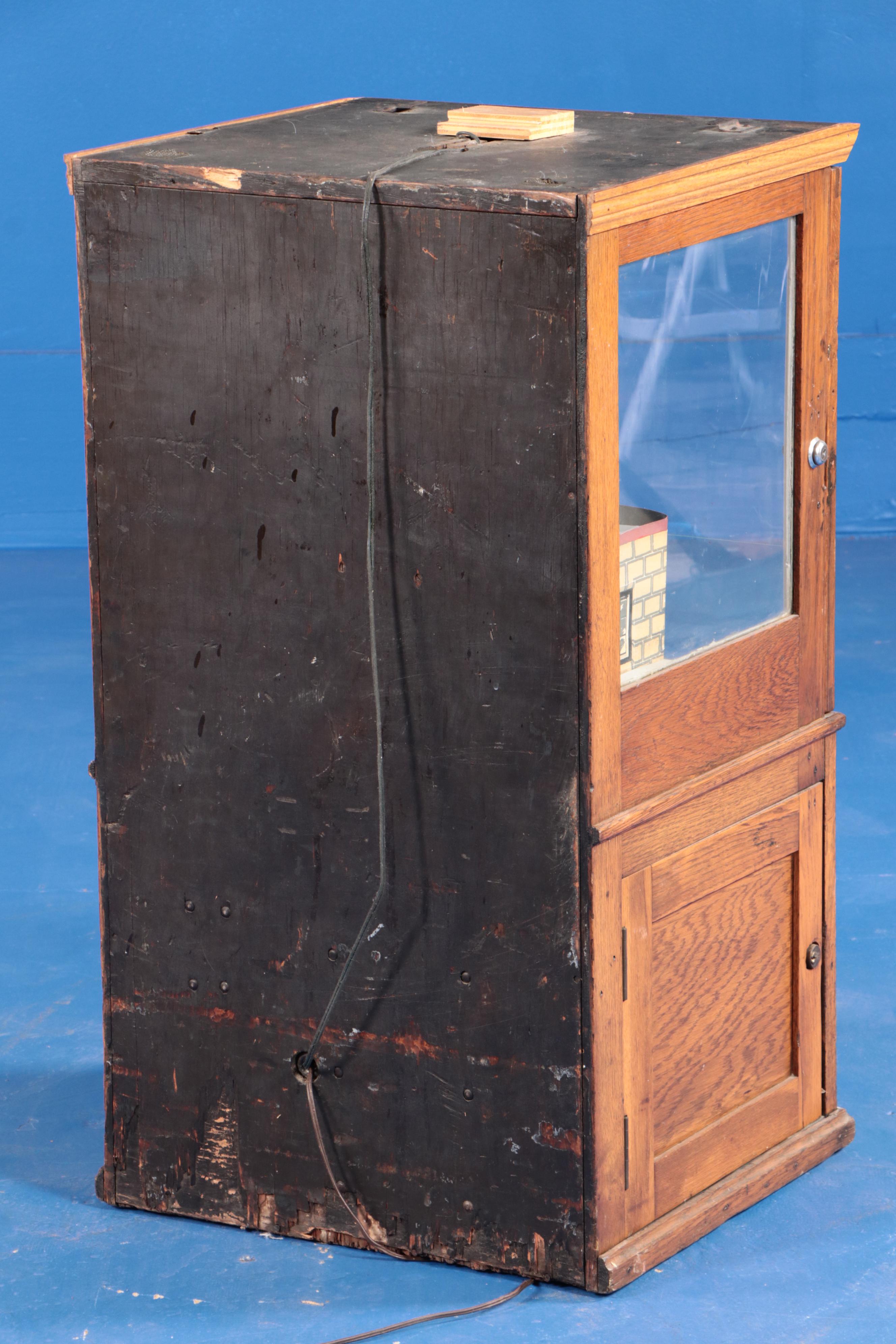 Exhibit Supply Co. Iron Claw Oak Cased Arcade Claw Machine, Early 20th Century