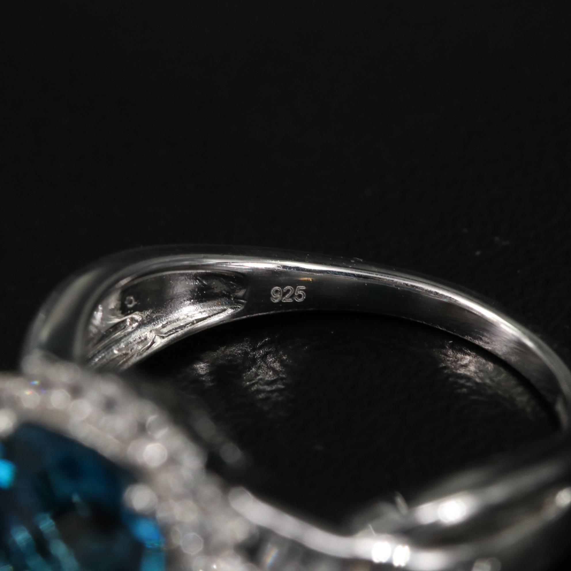 Sterling Blue Topaz and White Sapphire Crossover Ring