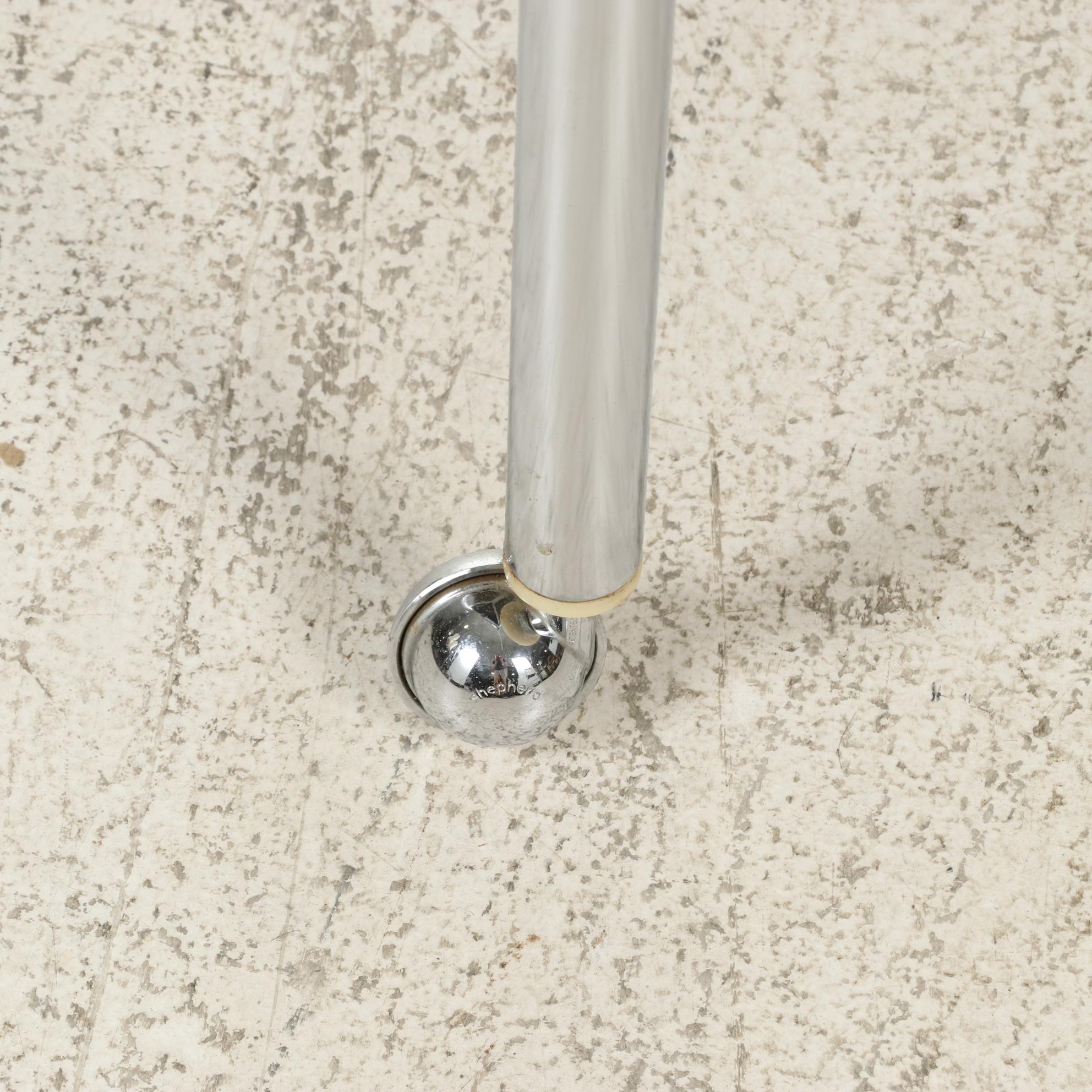 Four Tubular Chromed Metal Upholstered Rolling Armchairs, attr. to Chromcraft