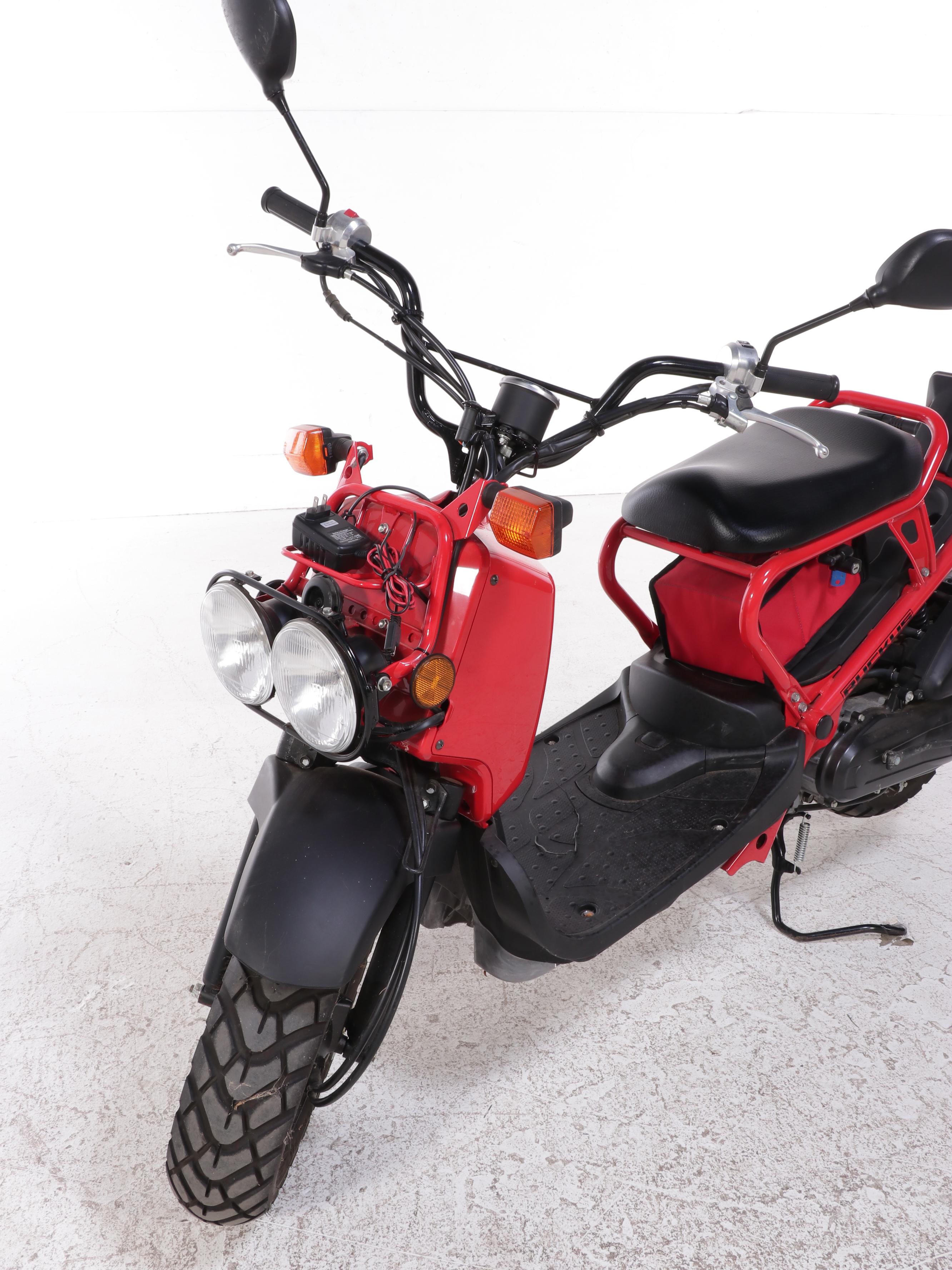 2009 Honda Ruckus Scooter in Red with with HJC Half-Shell Helmets