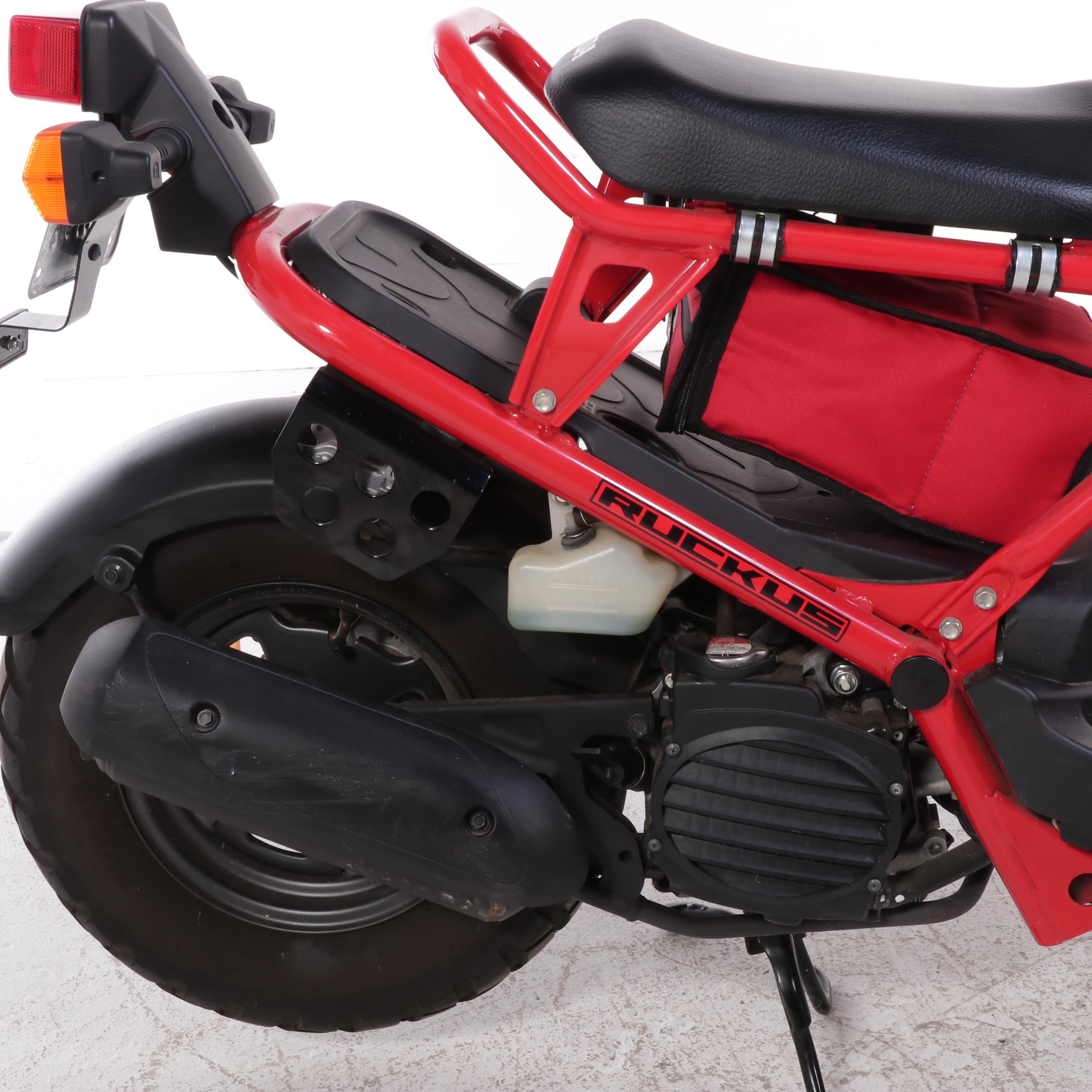 2009 Honda Ruckus Scooter in Red with with HJC Half-Shell Helmets