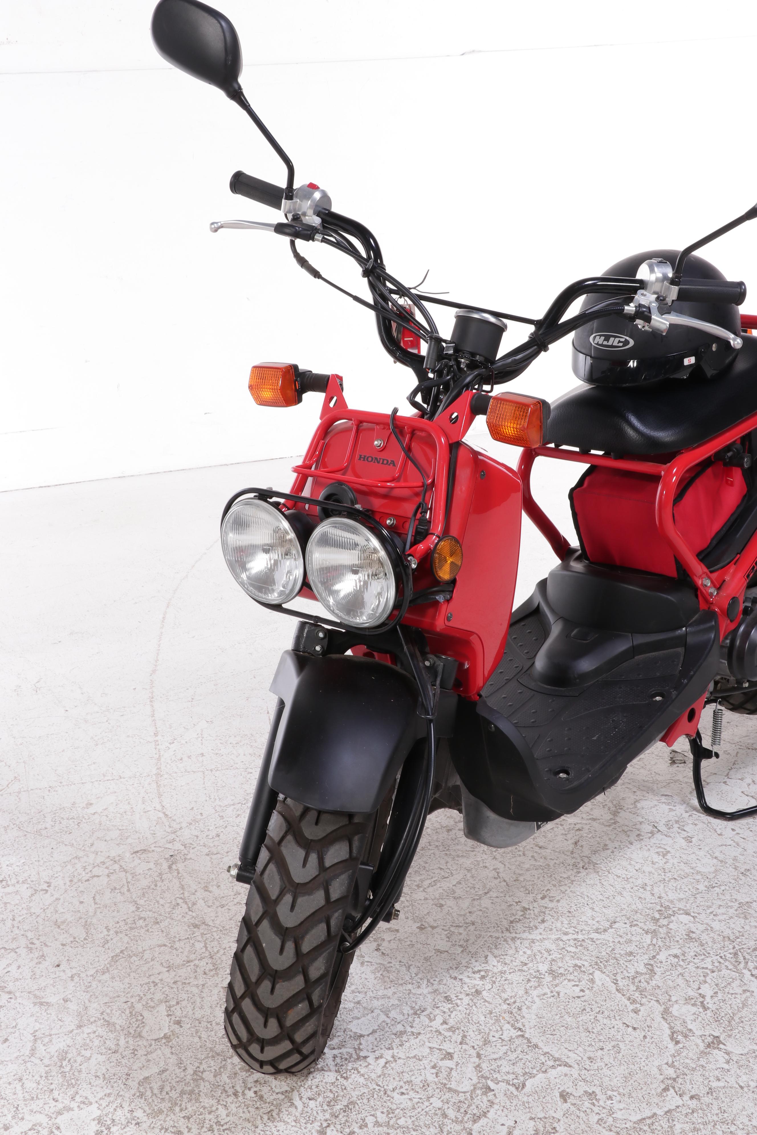 2009 Honda Ruckus Scooter in Red with HJC Half-Shell Helmets