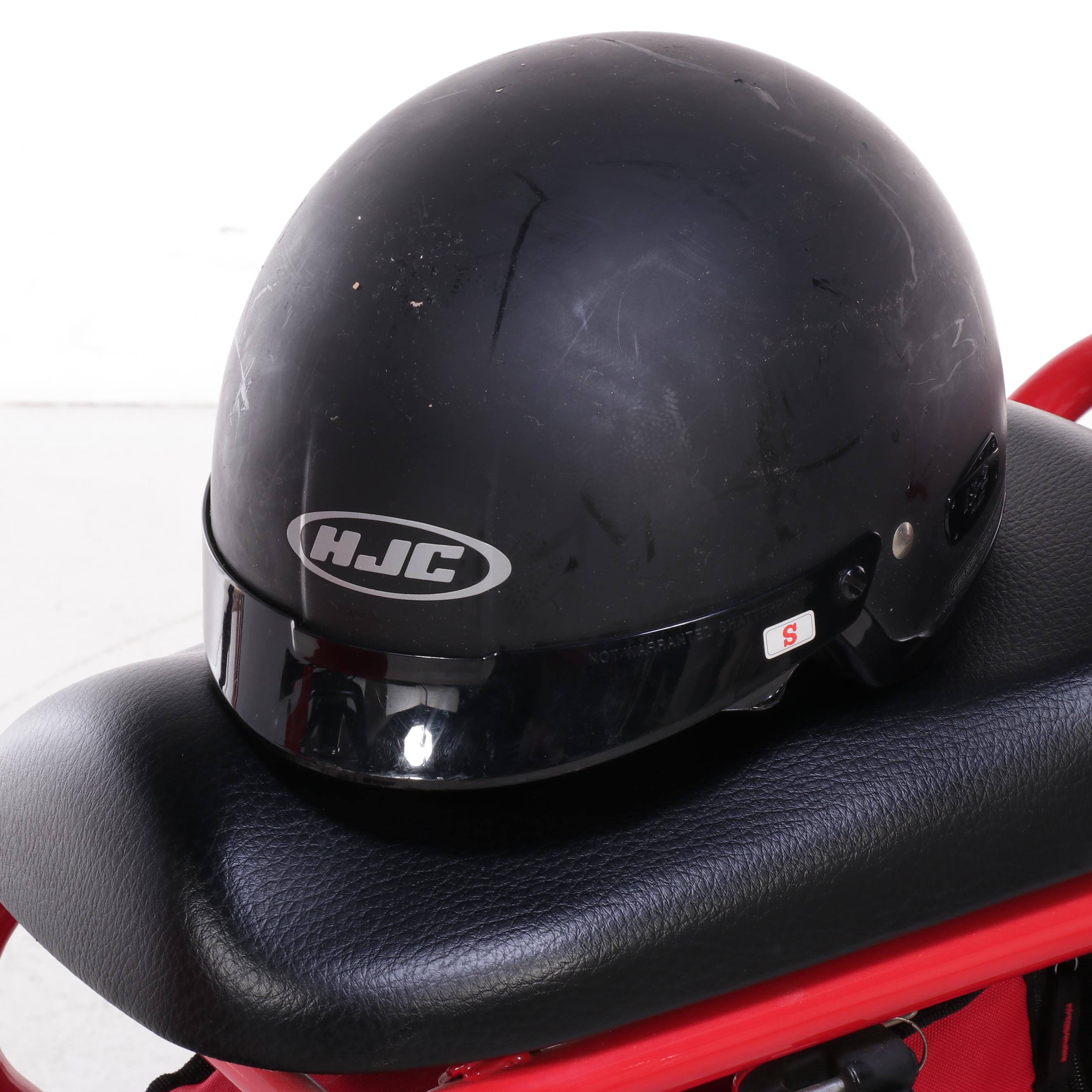2009 Honda Ruckus Scooter in Red with HJC Half-Shell Helmets