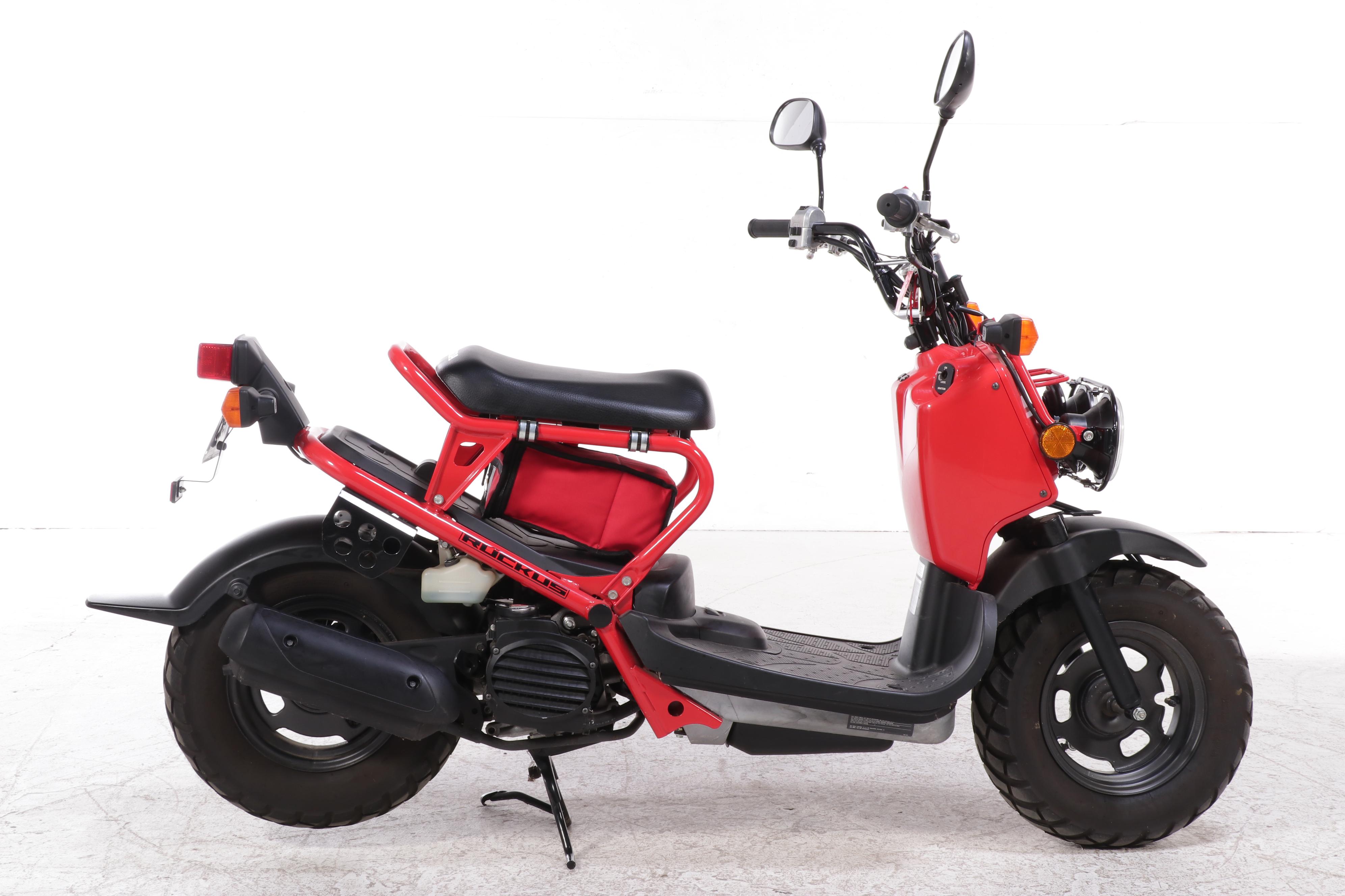2009 Honda Ruckus Scooter in Red with HJC Half-Shell Helmets