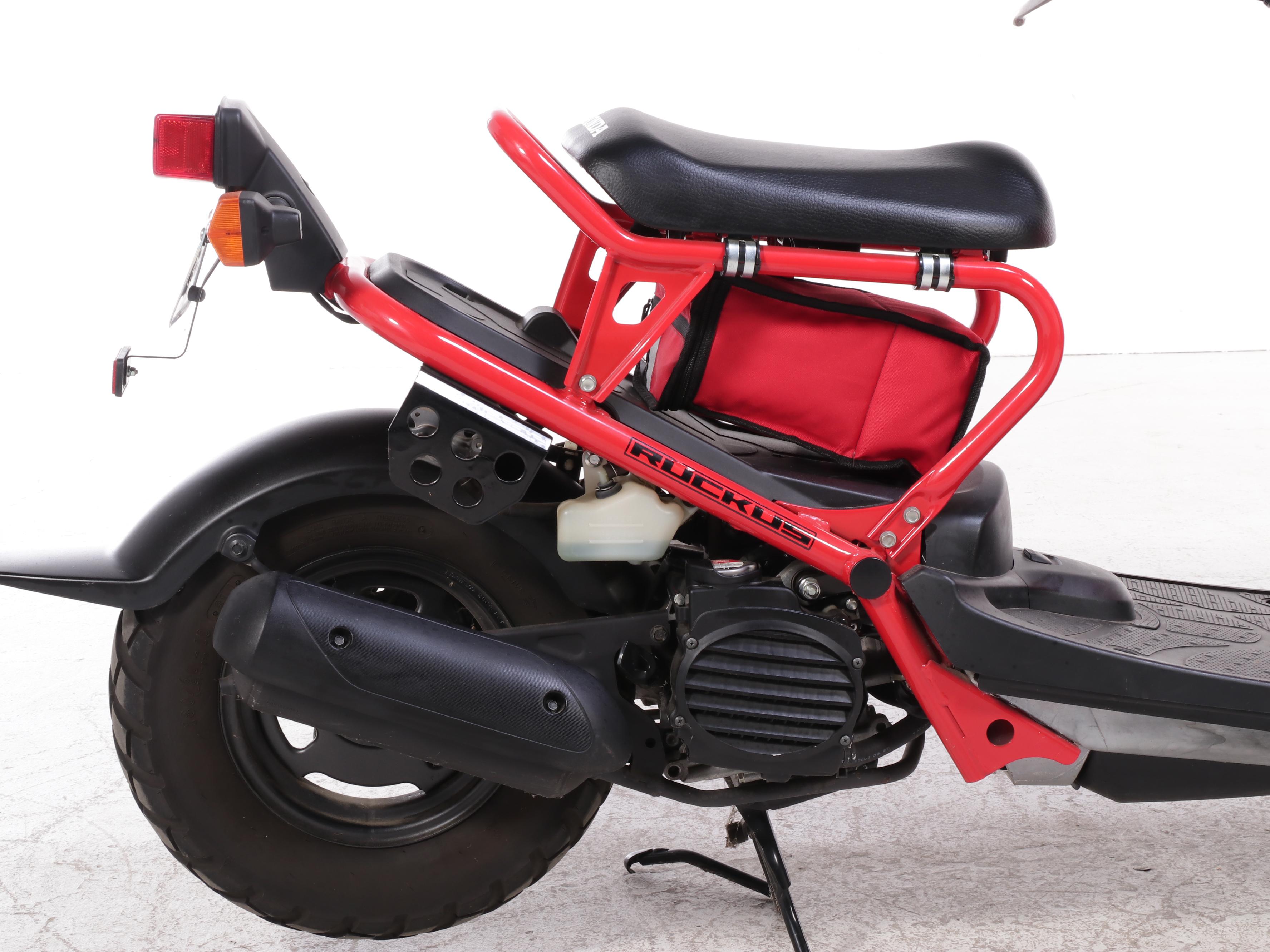 2009 Honda Ruckus Scooter in Red with HJC Half-Shell Helmets