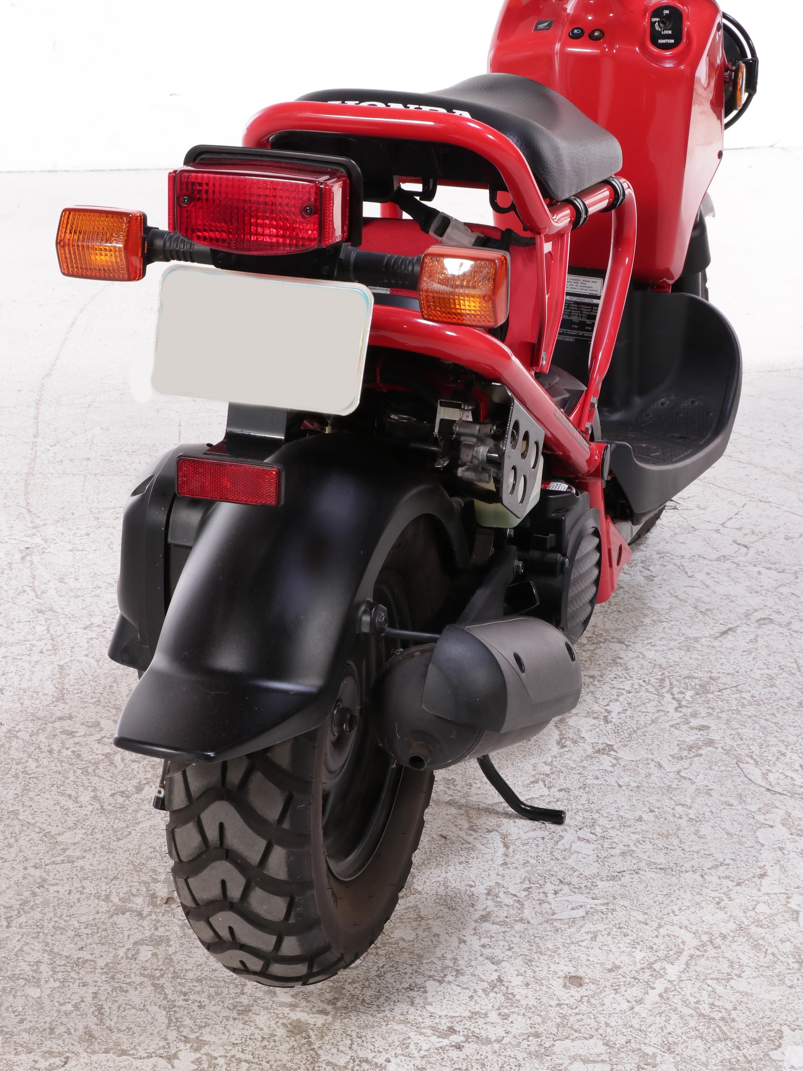 2009 Honda Ruckus Scooter in Red with HJC Half-Shell Helmets