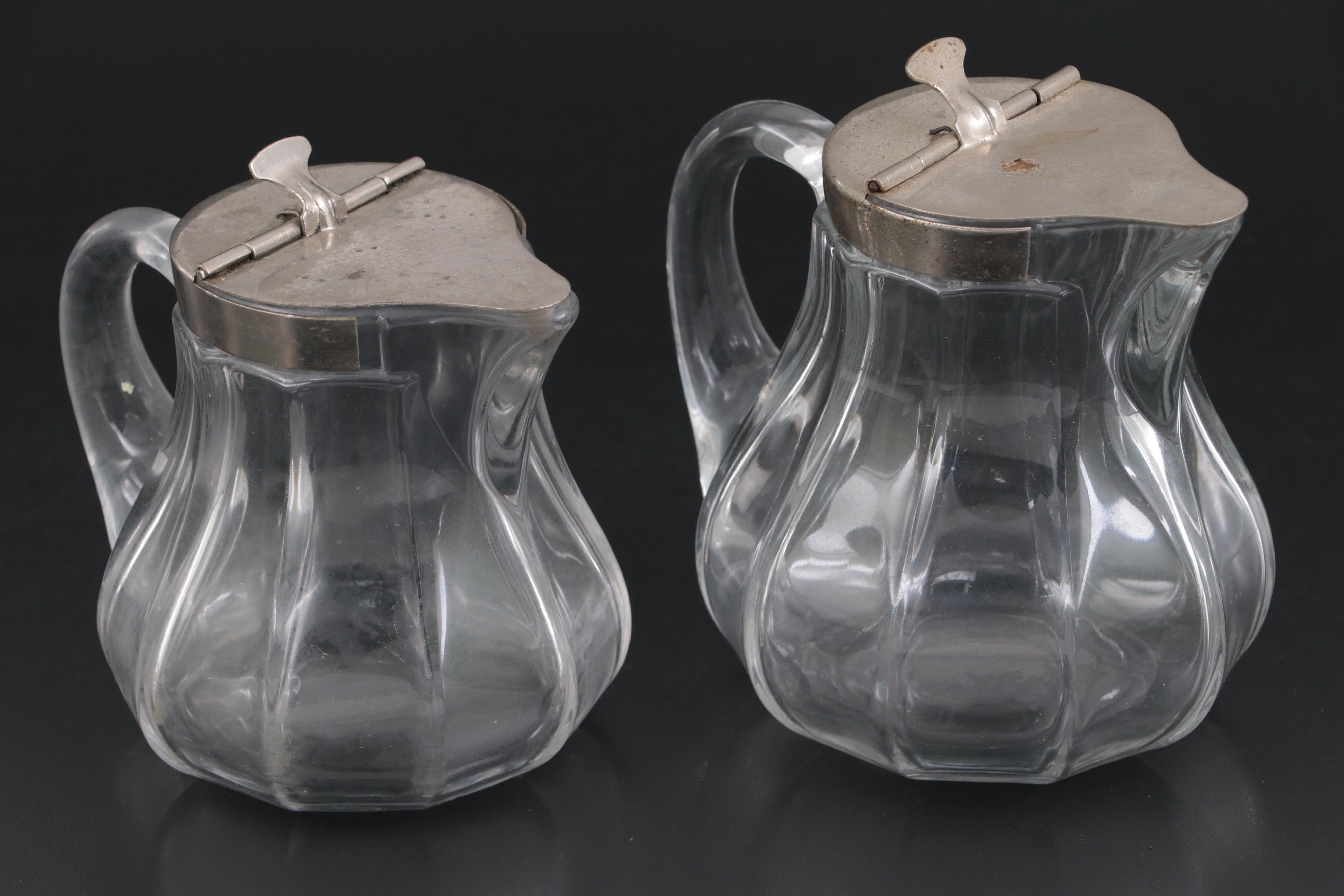 Heisey "Colonial Clear" and "Clear" Glass Syrup Pitchers with Sanitary Lids