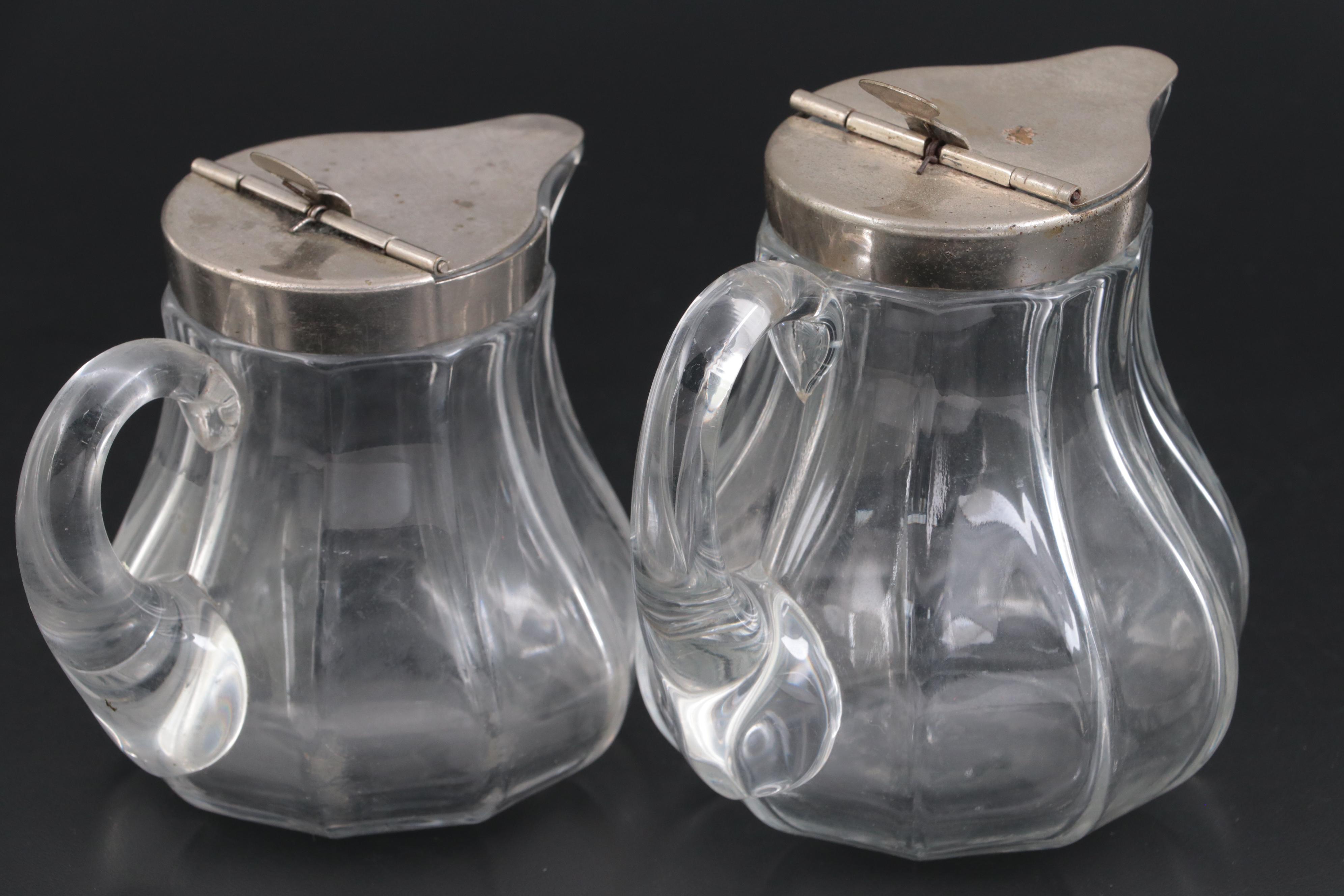 Heisey "Colonial Clear" and "Clear" Glass Syrup Pitchers with Sanitary Lids