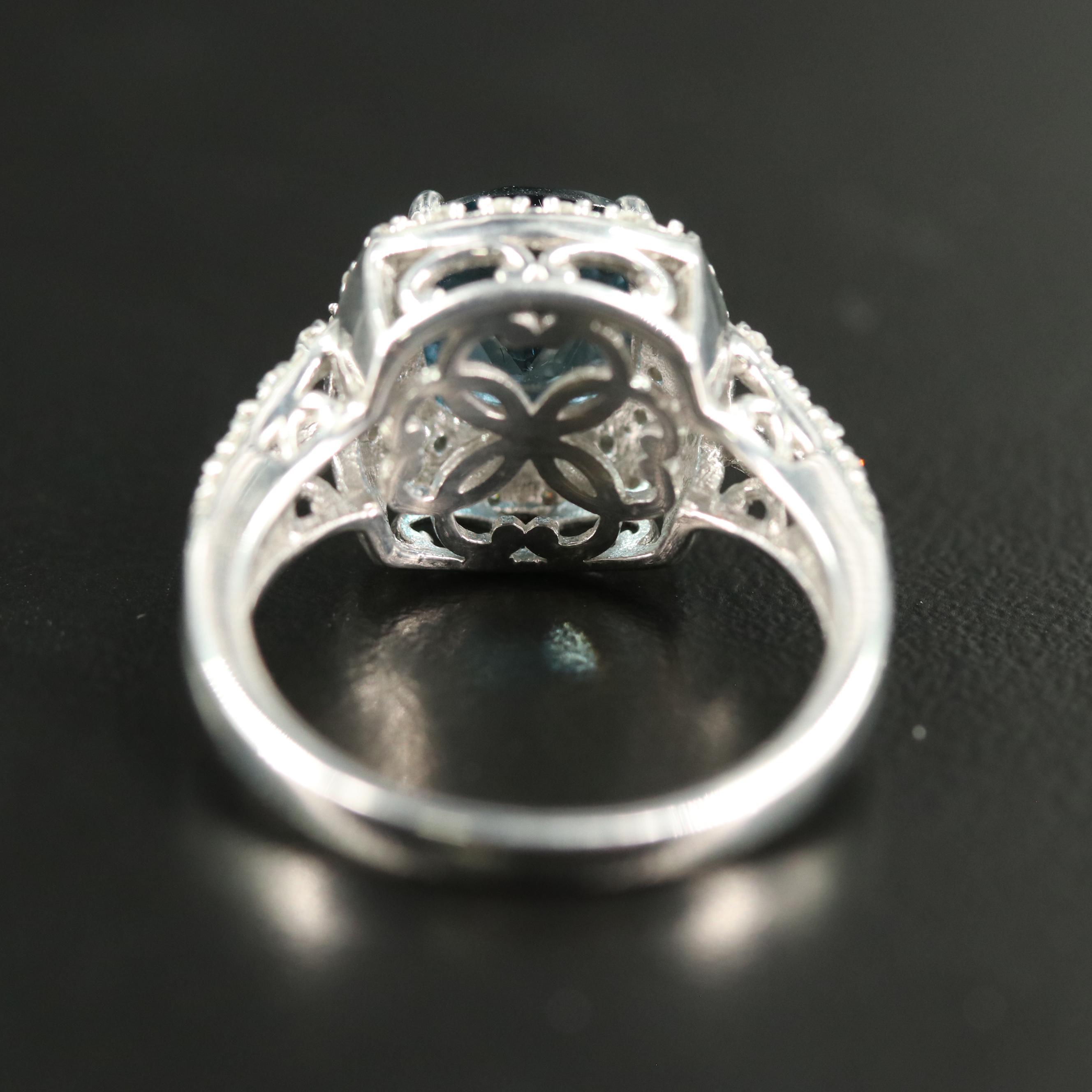 Sterling Blue Topaz and Diamond Halo Ring
