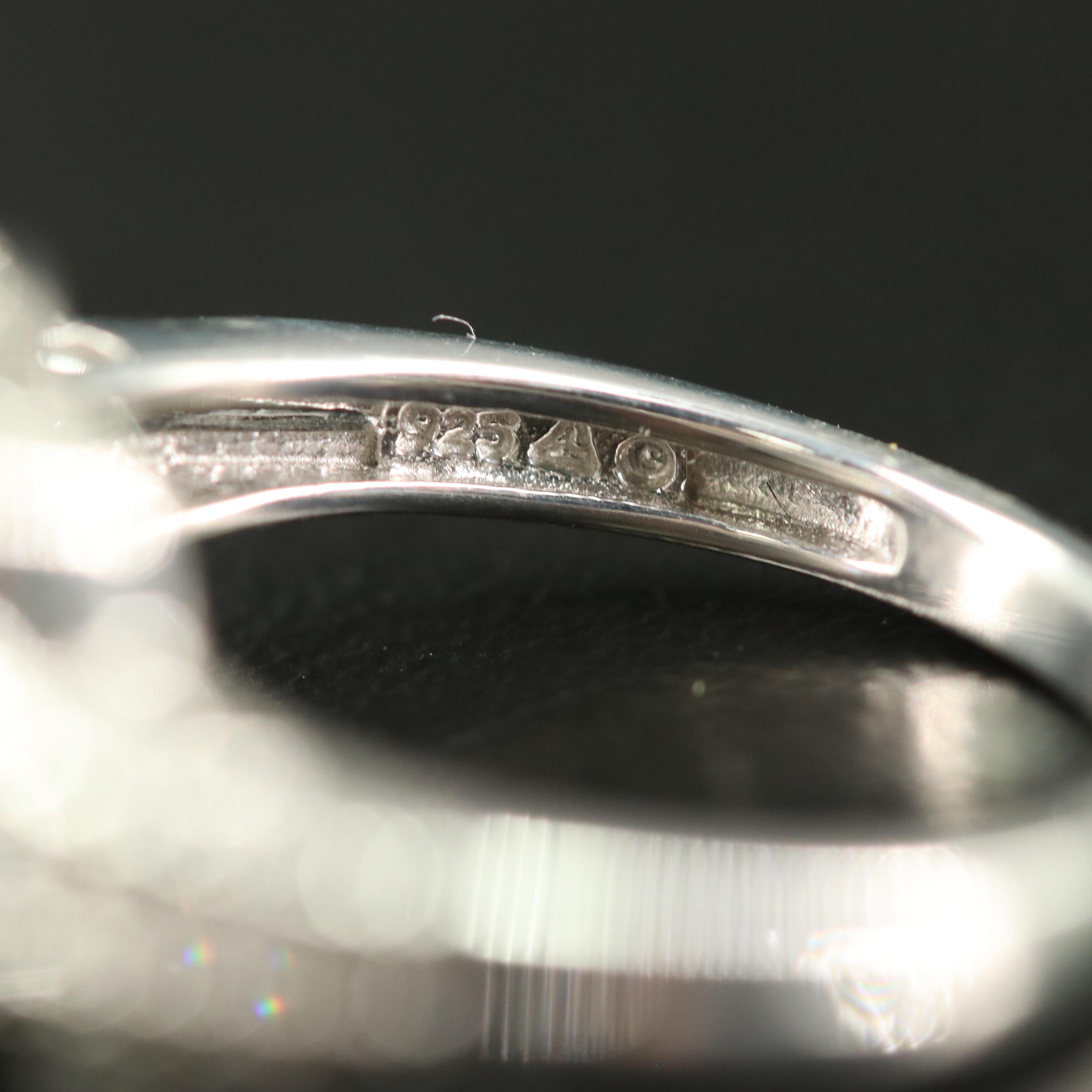 Sterling Blue Topaz and Diamond Halo Ring