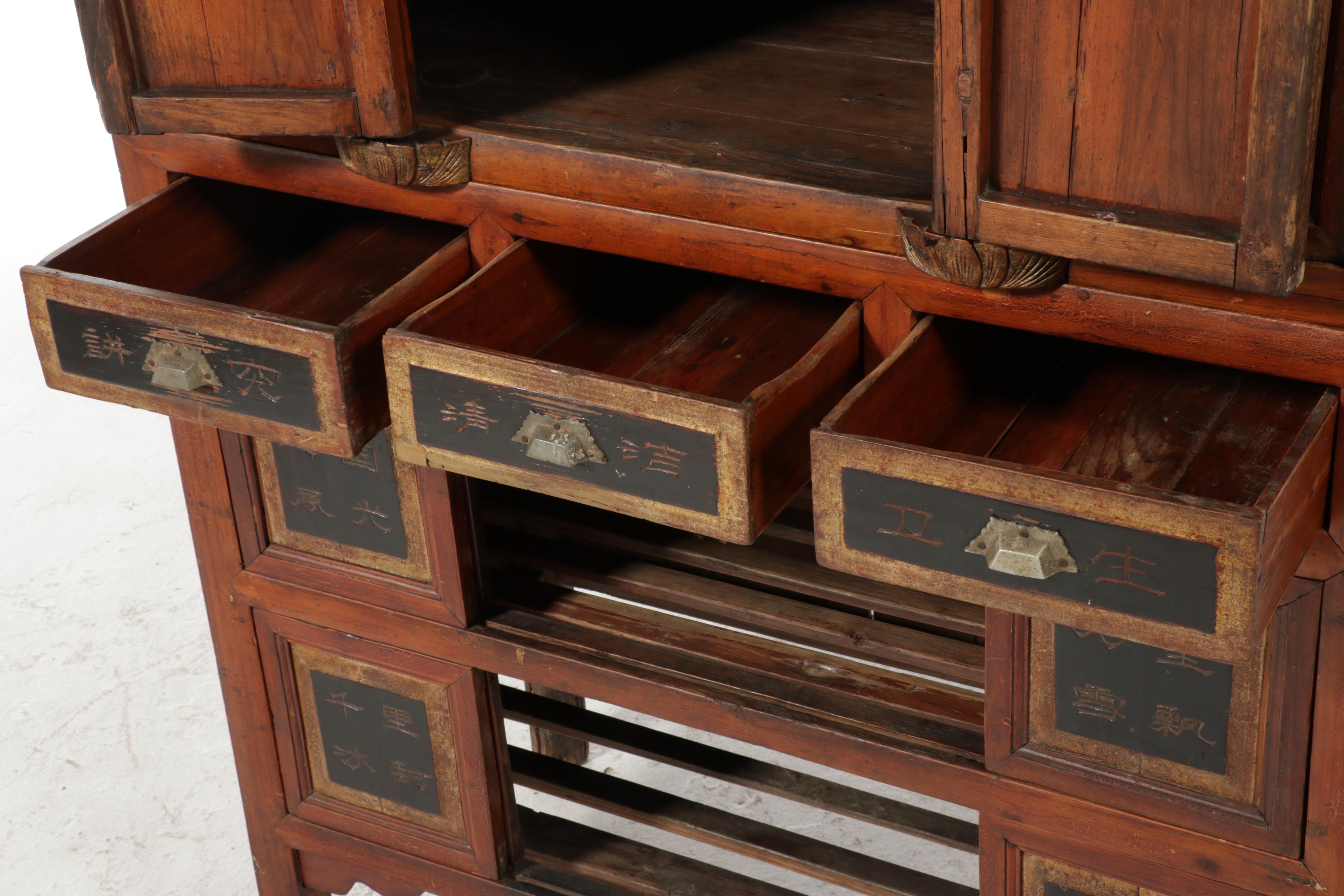 Chinese Two-Piece Lacquered, Carved and Gilt Cabinet