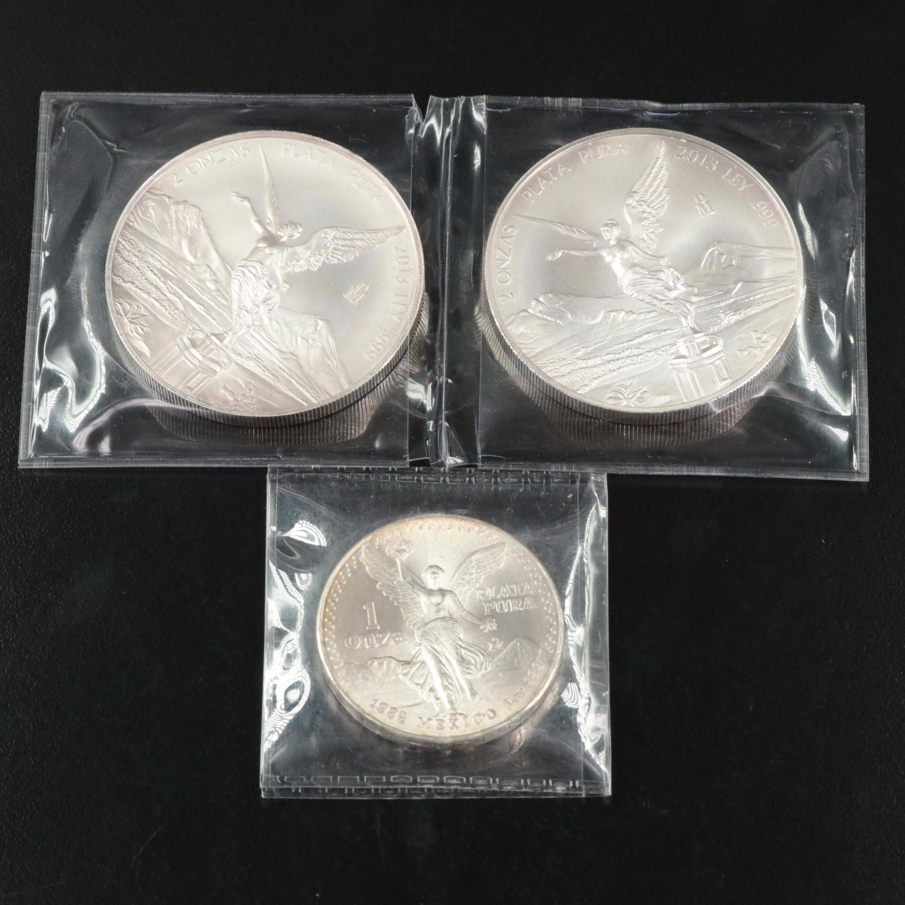 Two 2 ounce and a 1 Ounce Mexican .999 silver Coins