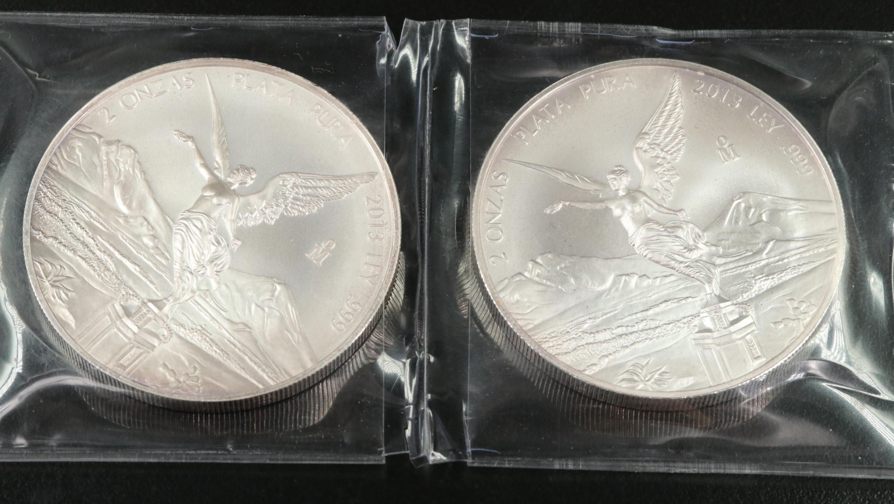 Two 2 ounce and a 1 Ounce Mexican .999 silver Coins
