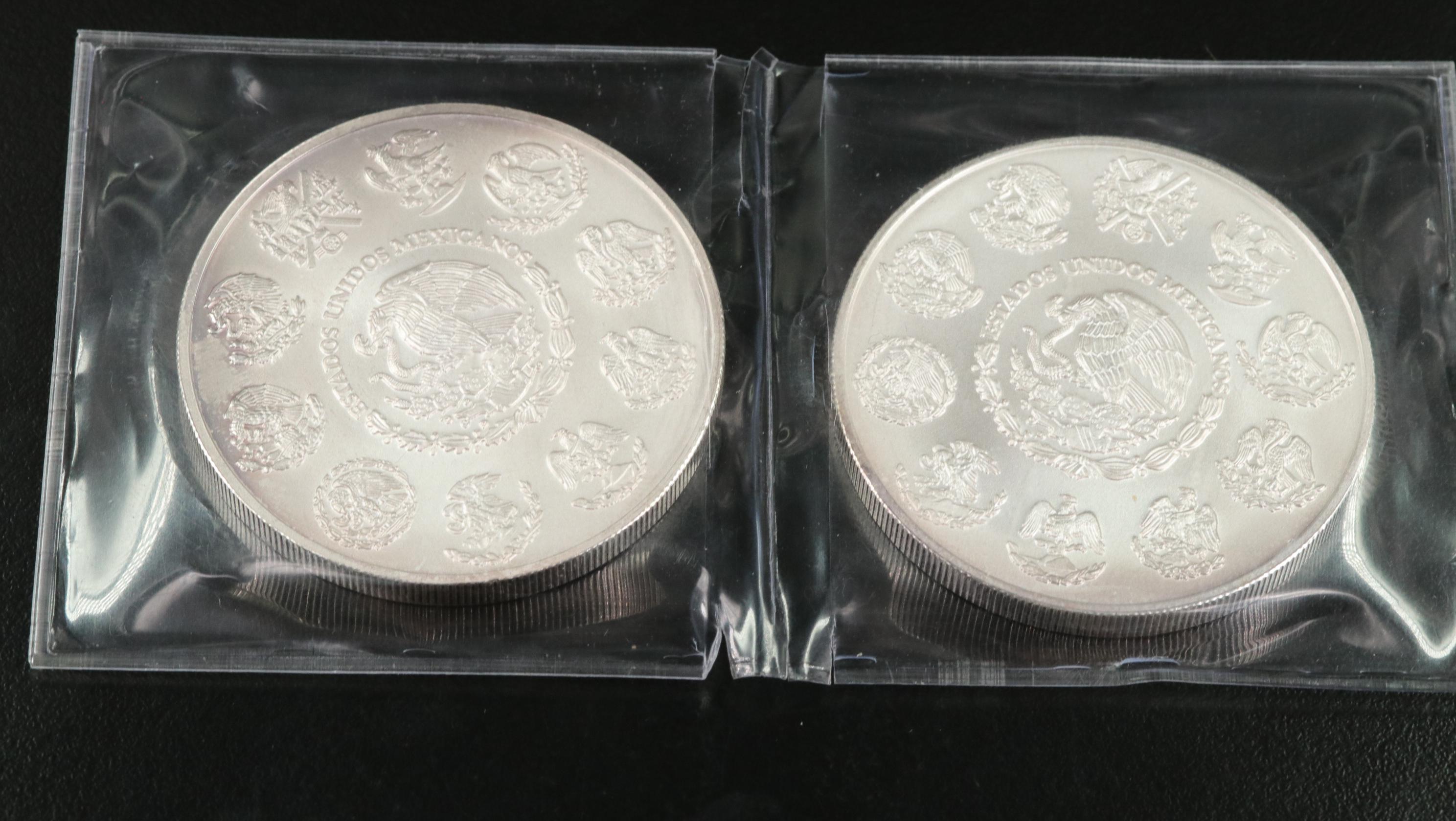 Two 2 ounce and a 1 Ounce Mexican .999 silver Coins