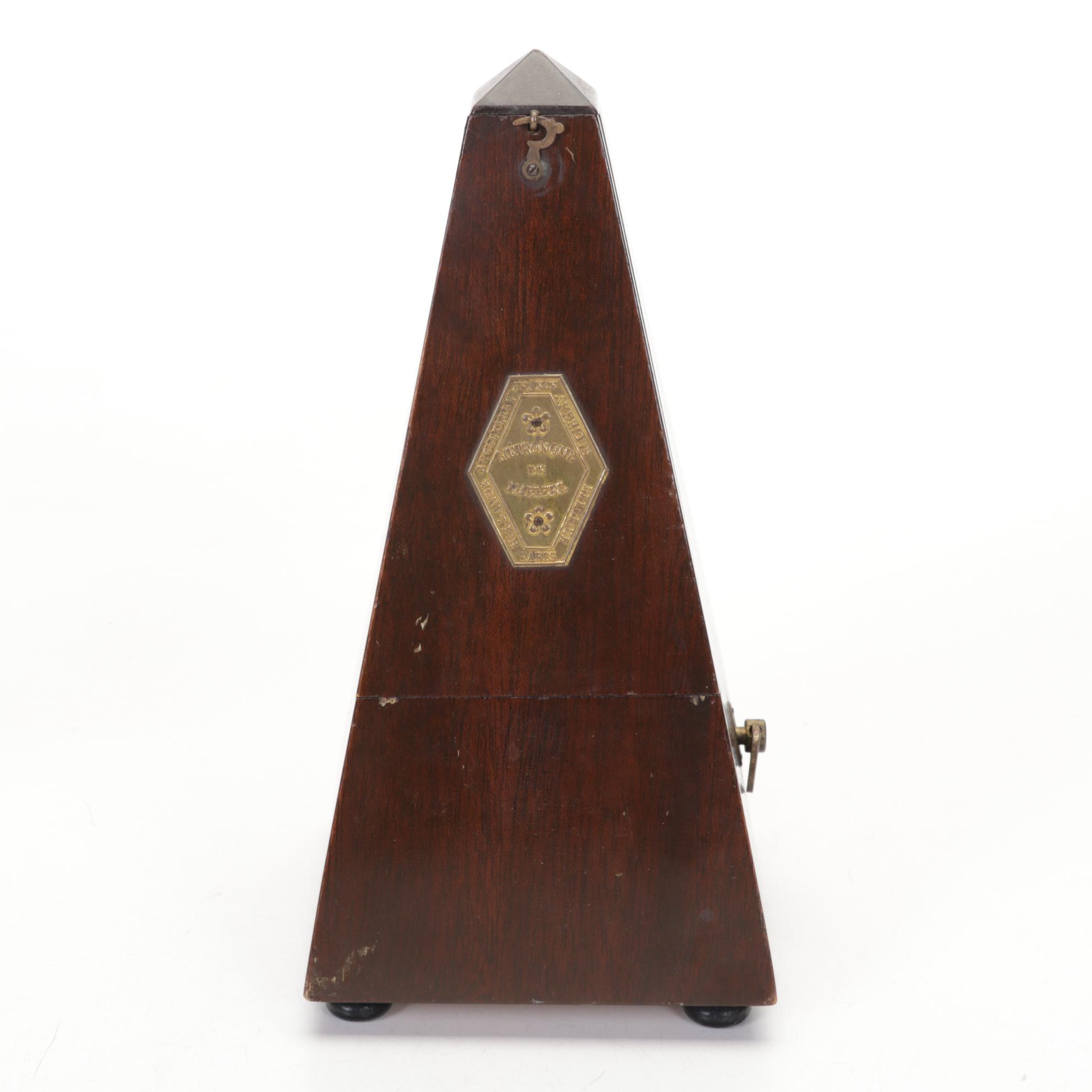 Metronome De Maelzel No 309, with St Clair Paperweights and Other Décor