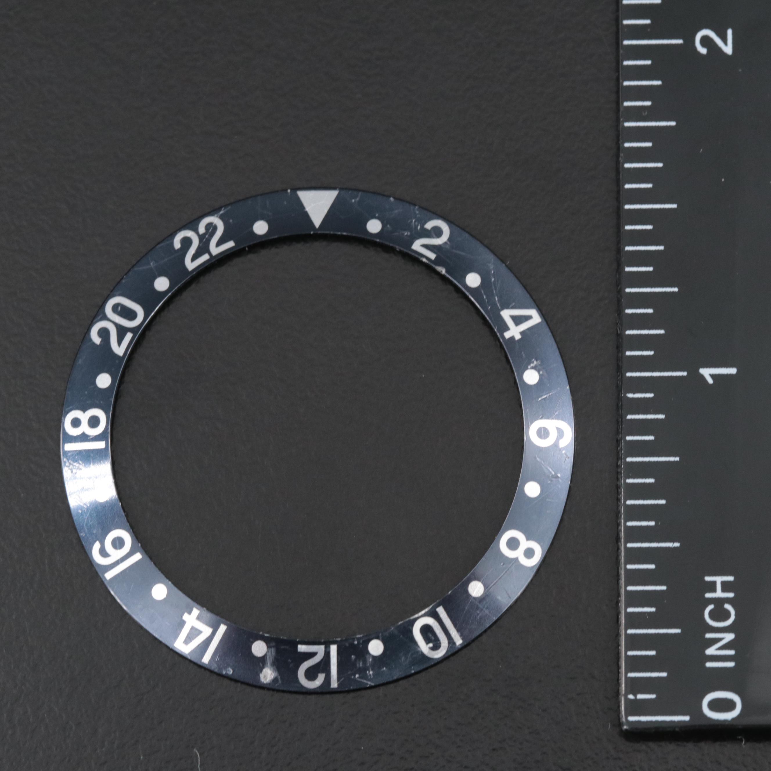 Two Rolex Dials and a Bezel Insert